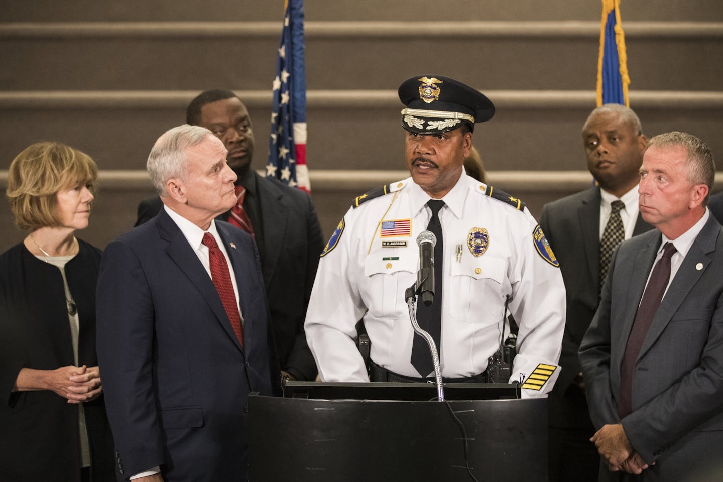 Lt. Governor Tina Smith, from left, Gov. Mark Dayton, St. Cloud Police Chief William Blair Anderson and St. Cloud Mayor David Kleis hold a press conference after meeting at St. Cloud City Hall.