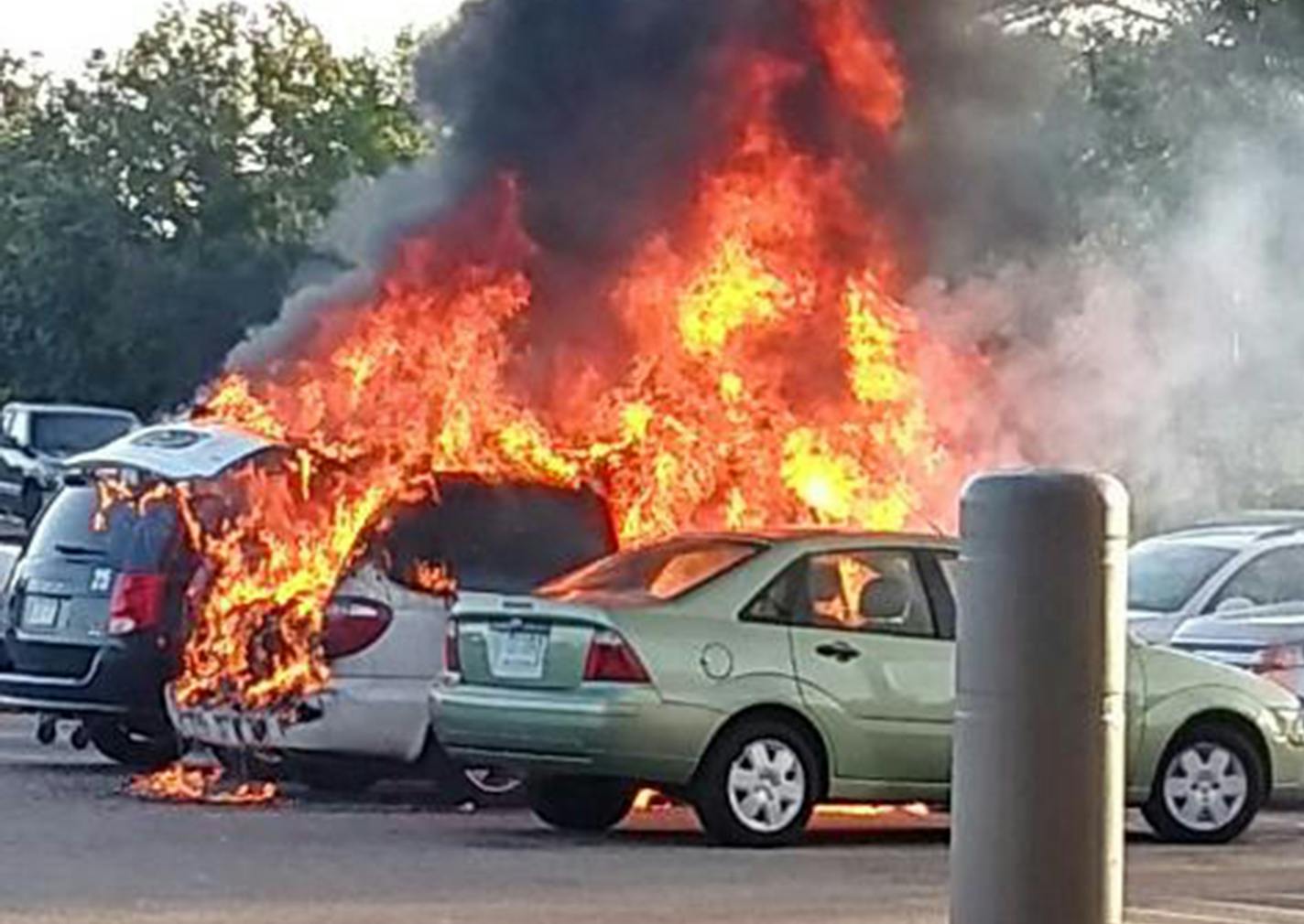 Two vans parked side by side outside a Walmart in Fridley caught fire Tuesday morning, and two young sisters alone in one of the vehicles were burned, authorities said.