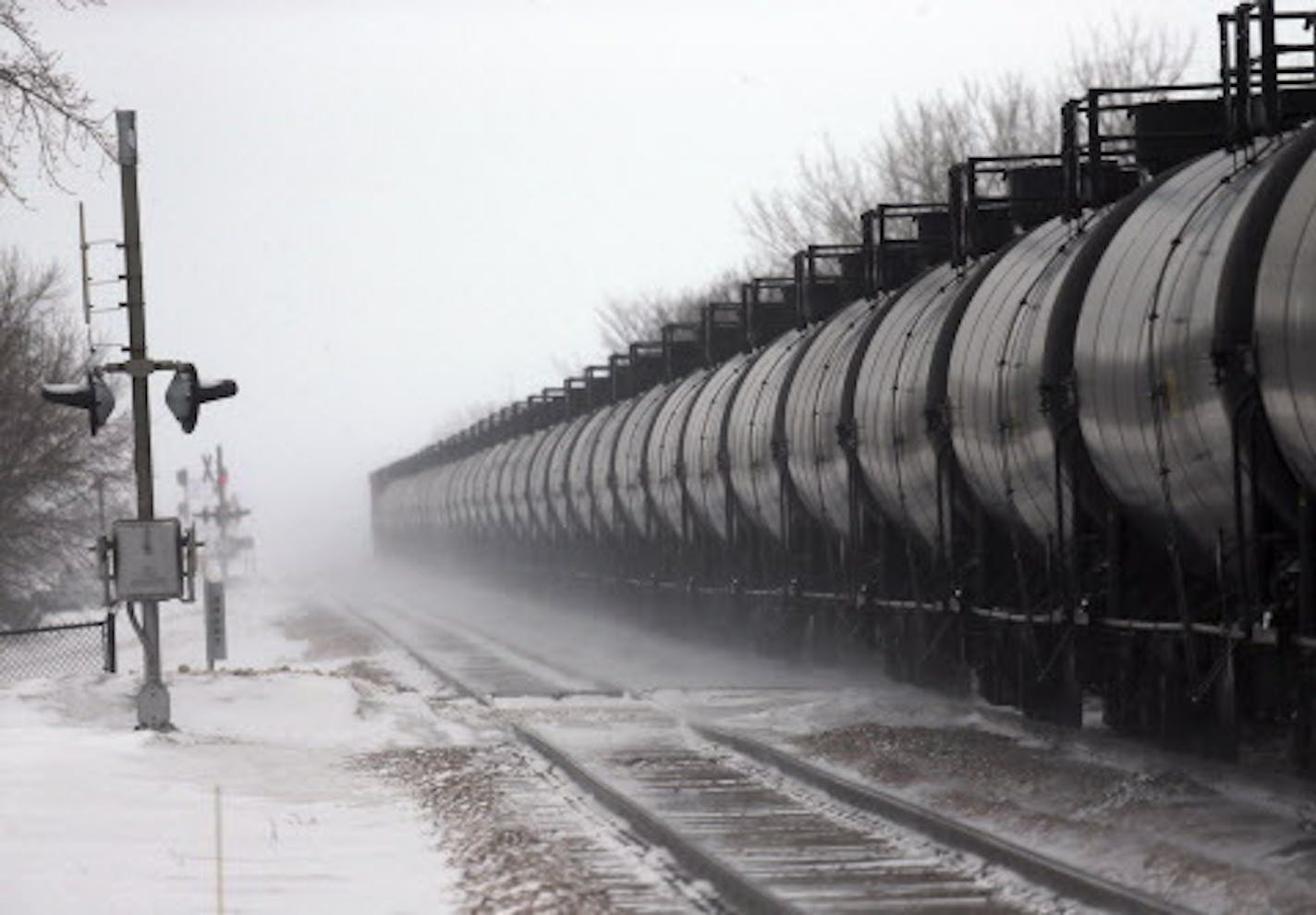 Cars on an oil train roll through Casselton, N.D., Jan. 16, 2014. A fiery rail accident last month in Casselton, N.D., which prompted residents to evacuate the town, has shattered people's confidence in the crude-oil convoys that rumble past seven times a day. (Jim Wilson/The New York Times) ORG XMIT: MIN2014021414074052