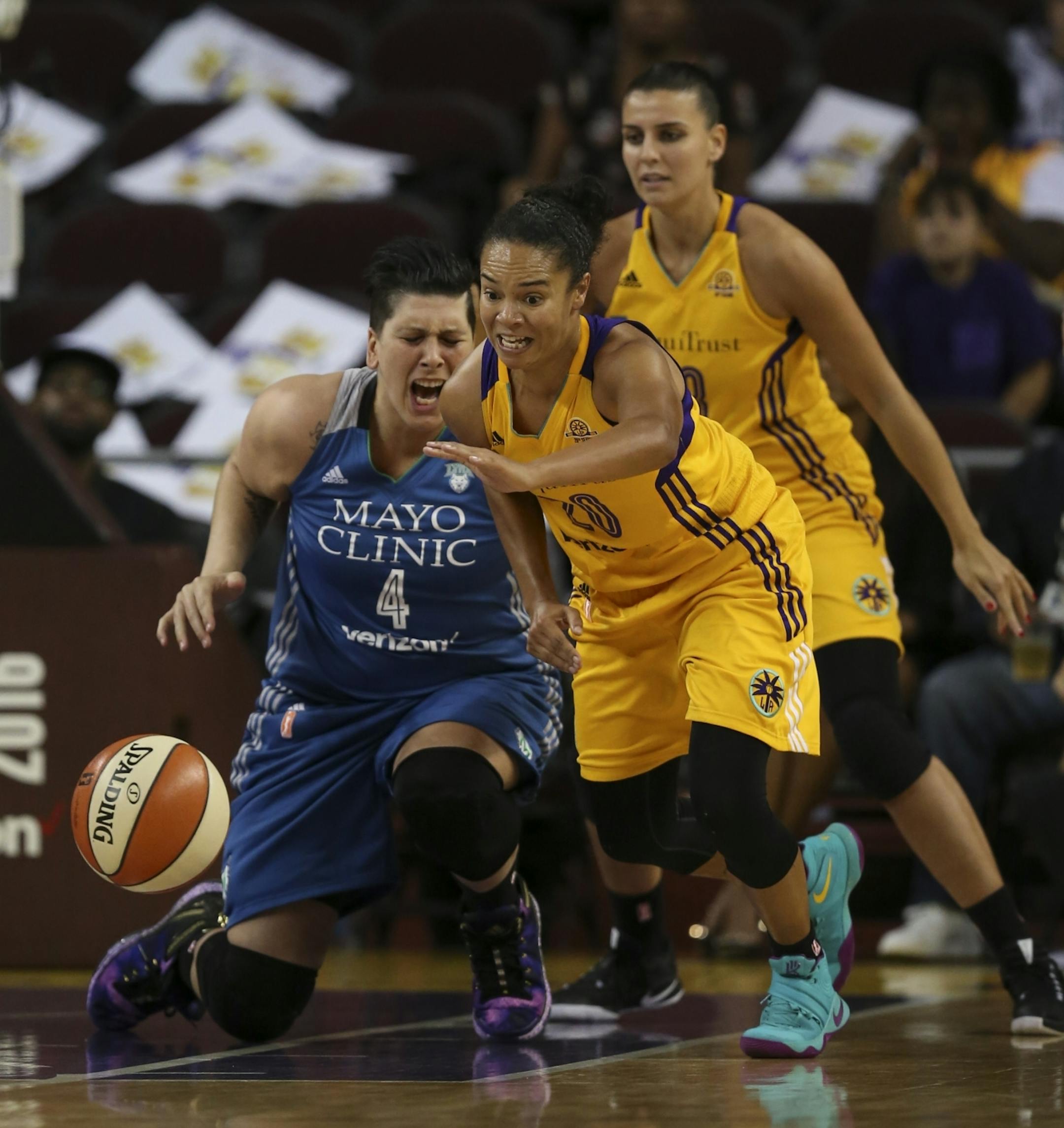 Minnesota Lynx center Janel McCarville (4) started heading to the floor after loosing control of the all near Los Angeles Sparks guard Kristi Toliver (20) in the third quarter.