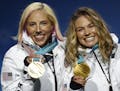 Gold medalists in the women's team sprint freestyle cross-country skiing Kikkan Randall and Jessica Diggins, of the United States, pose during the med