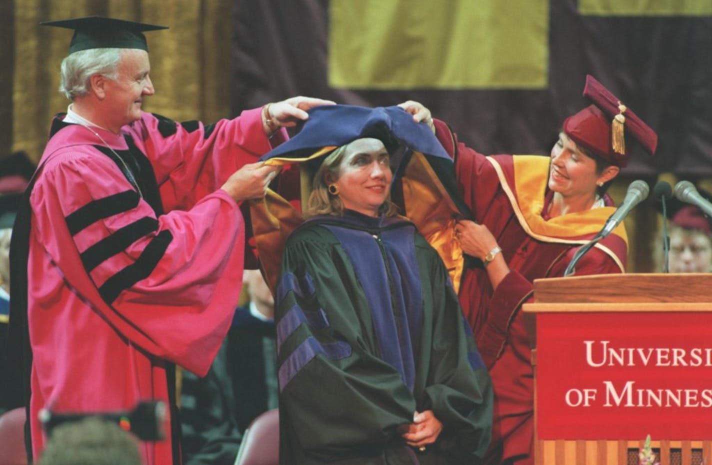 First lady Hillary Rodham Clinton receives an honorary doctorate of laws degree from University President Nils Hasslemo, left, and Regent Chair Jean Keffeler, at the University of Minnesota College of Liberal Arts Commencement, Sunday, June 11, 1995, inMinneapolis. Mrs. Clinton gave the commencement speech.