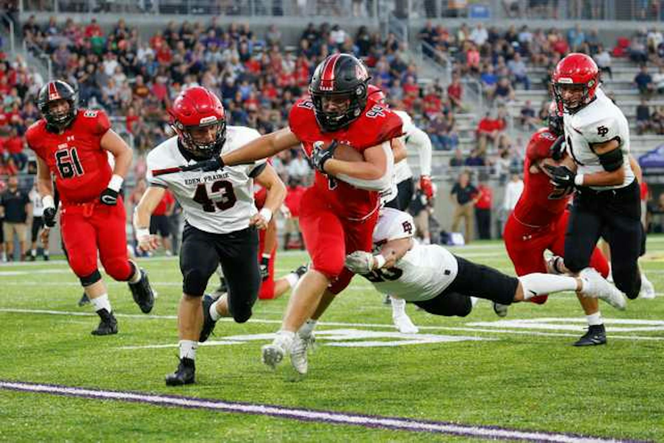 Shakopee senior Jack Casey (44) broke tackles for a first down against Eden Prairie in a game on Sept. 20 at TCO Stadium in Eagan. Photo by Jeff Lawler, SportsEngine