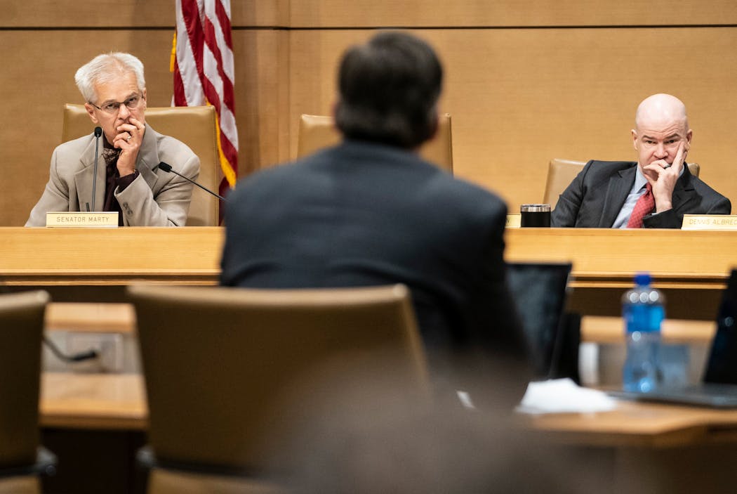 State Sen. John Marty, DFL-Roseville left, and legislative analyst Liam Monahan participate in a hearing at the Senate Office Building in St. Paul in 2019. Marty has proposed legislation this session that would ban medical-debt buying.