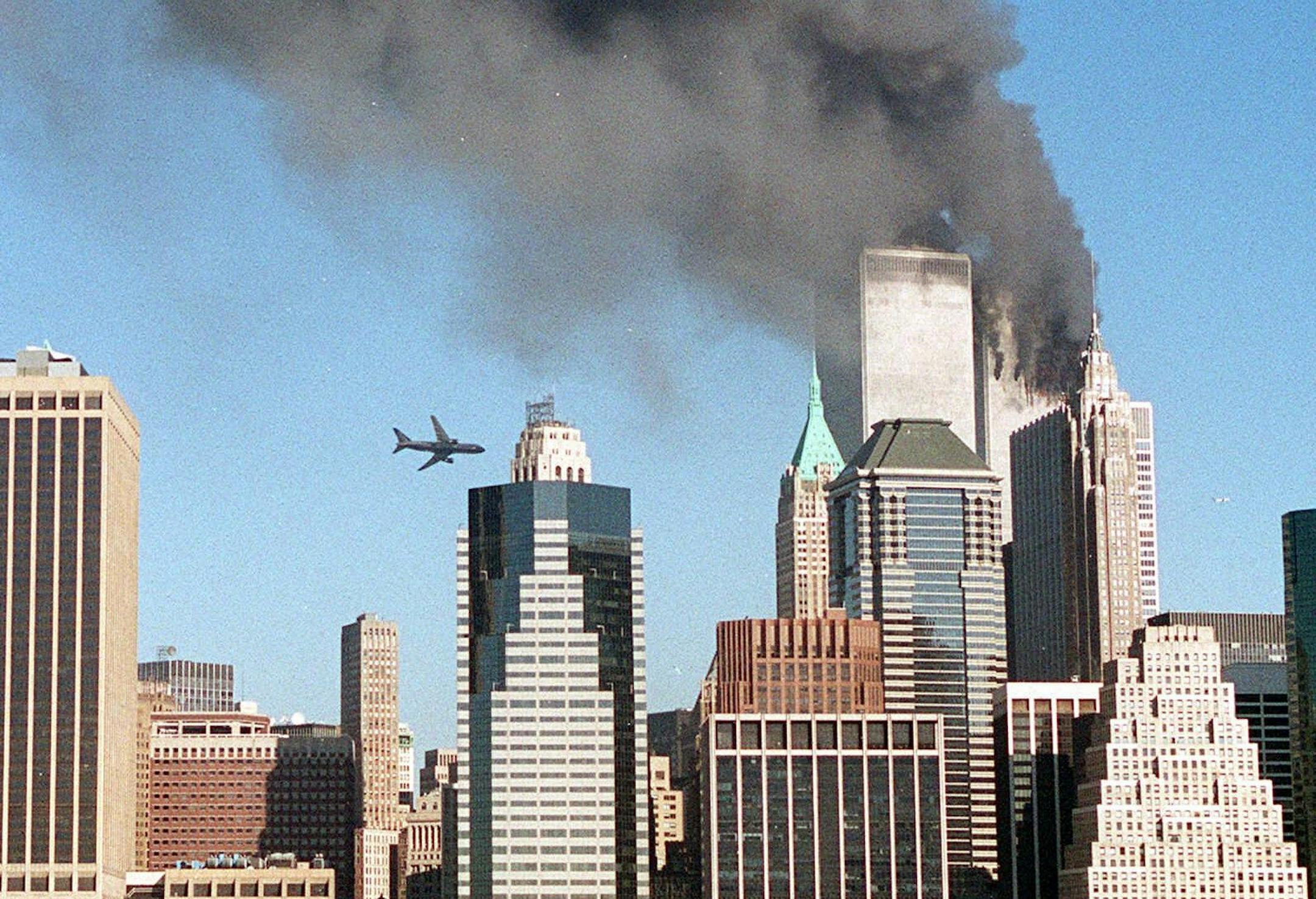 (NYT2) NEW YORK -- Sept. 11, 2001 -- TERROR-RDP-2 -- A second aircraft approaches the World Trade Center just prior to hitting the skyscraper, Monday. Within a span of 18 minutes, two planes crashed into each of the twin towers of the World Trade Center in Manhattan in what President Bush said in a short announcement was "a national tragedy and an apparent act of terrorism against our country." (Kelly Guenther/The New York Times) *LITE ** MAGS OUT - NO SALES **