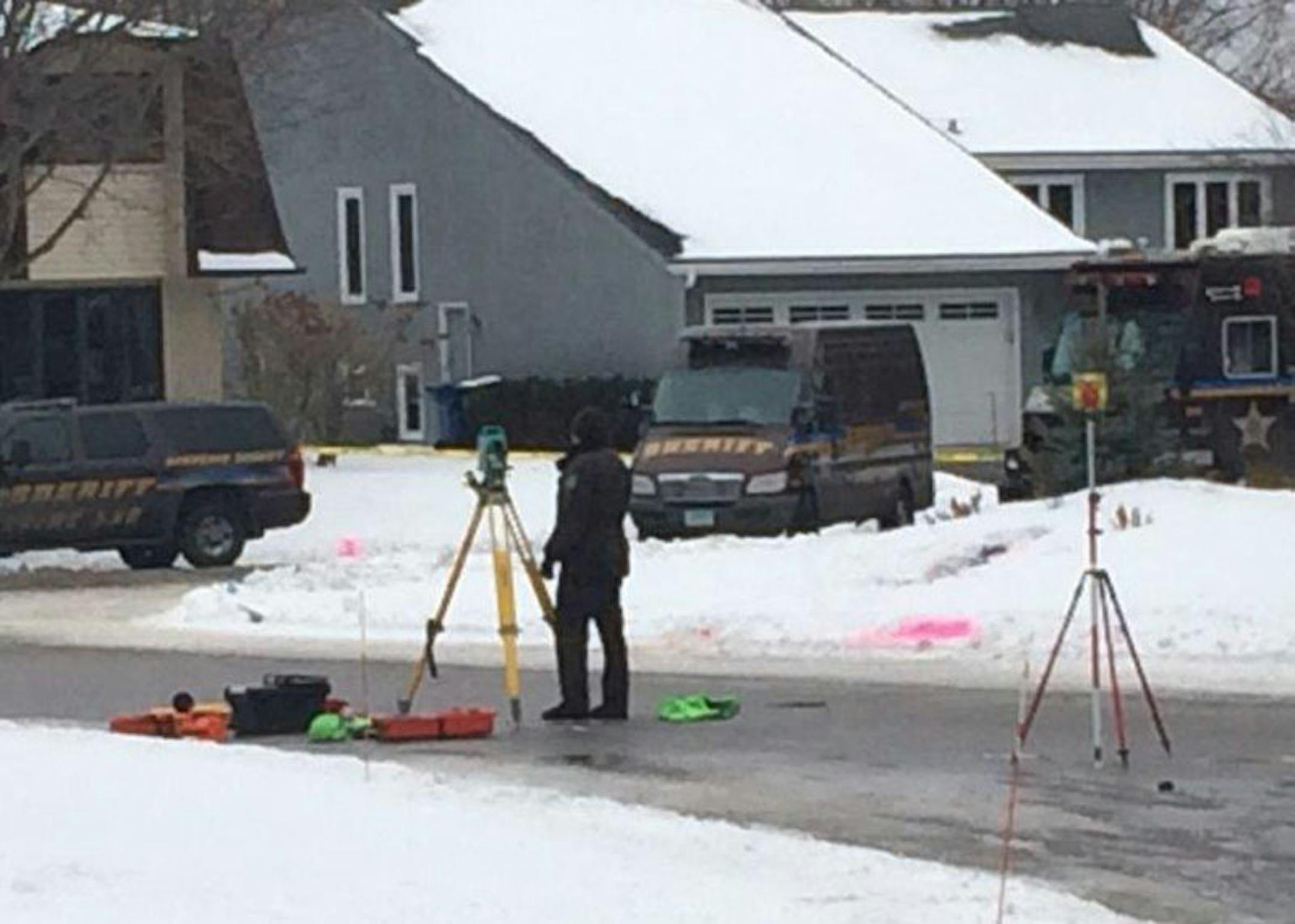 A Hennepin County Sheriff's Office technician worked at the scene of an officer-involved shooting in Bloomington. The pink paint marks the spot where a suicidal man was killed.