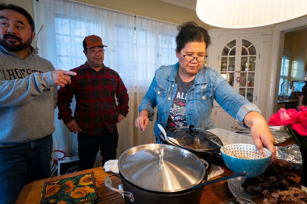 Kaohly Her prepared the serving table for the annual year-end potluck gathering of the Asian American philanthropic family group Building More Philanthropy with Purpose (aka Bad Mo Pho Phamily).