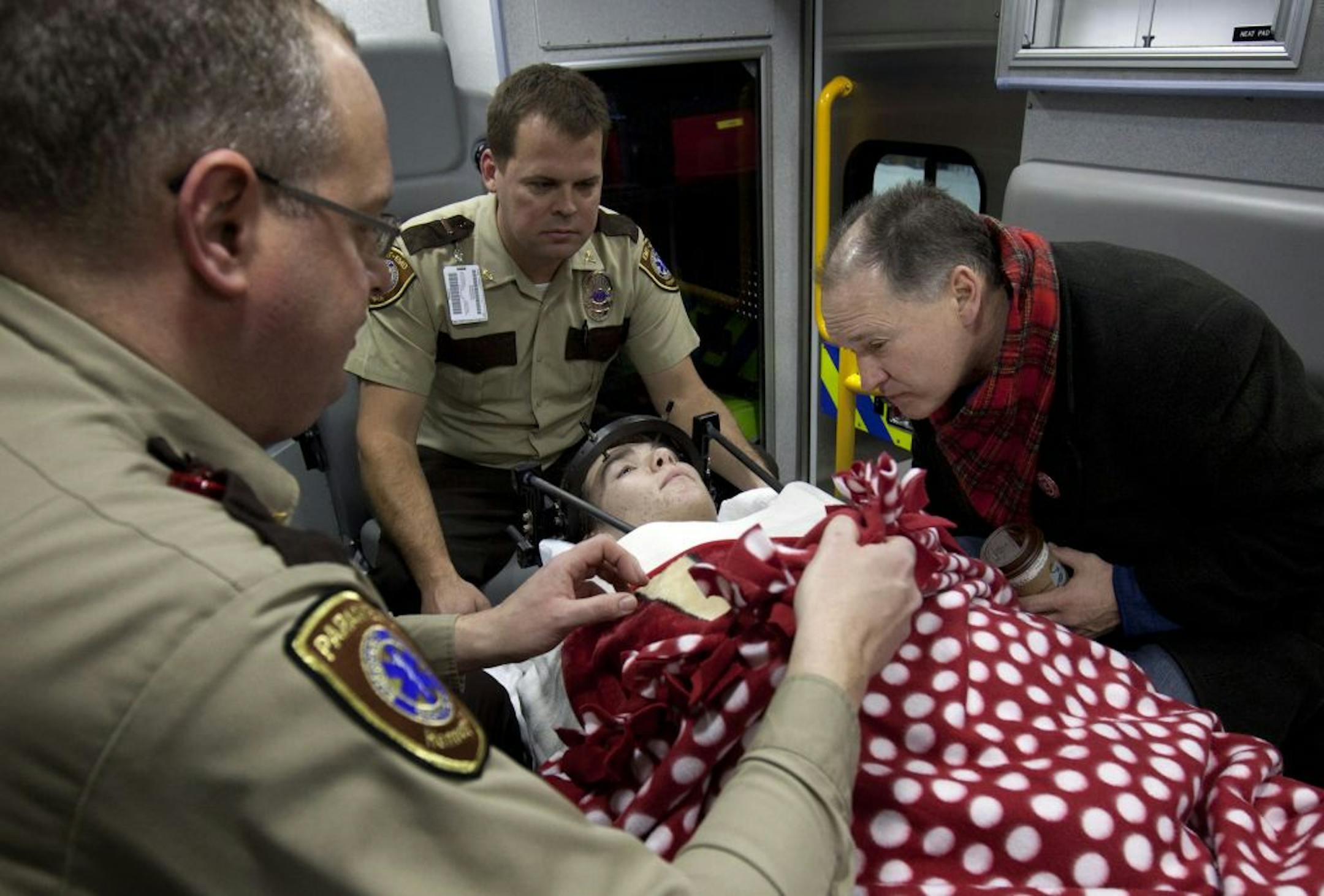 Jack Jablonski, 16, along with his father, Mike, rode in an ambulance with paramedics as he was transferred from Hennepin County Medical Center to the Sister Kenny Rehabilitation Institute in Minneapolis. His spinal cord was injured during a Dec. 30 hockey game.