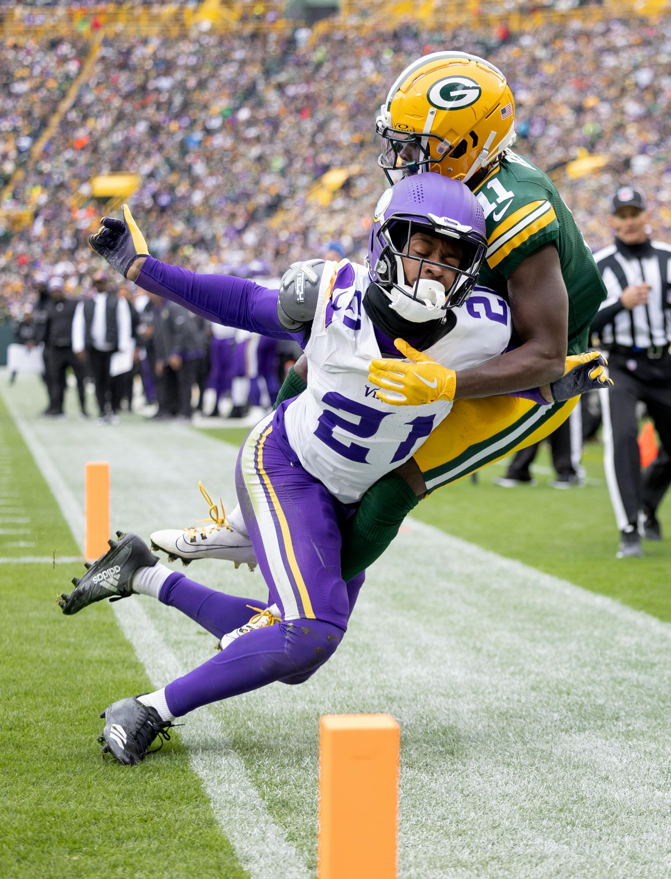 Minnesota Vikings defensive back Akayleb Evans (21) is called for pass interference on Jayden Reed (11) of the Green Bay Packers in the third quarter Sunday, October 29, 2023, at Lambeau Field in Green Bay, Wis. ] CARLOS GONZALEZ • carlos.gonzalez@startribune.com