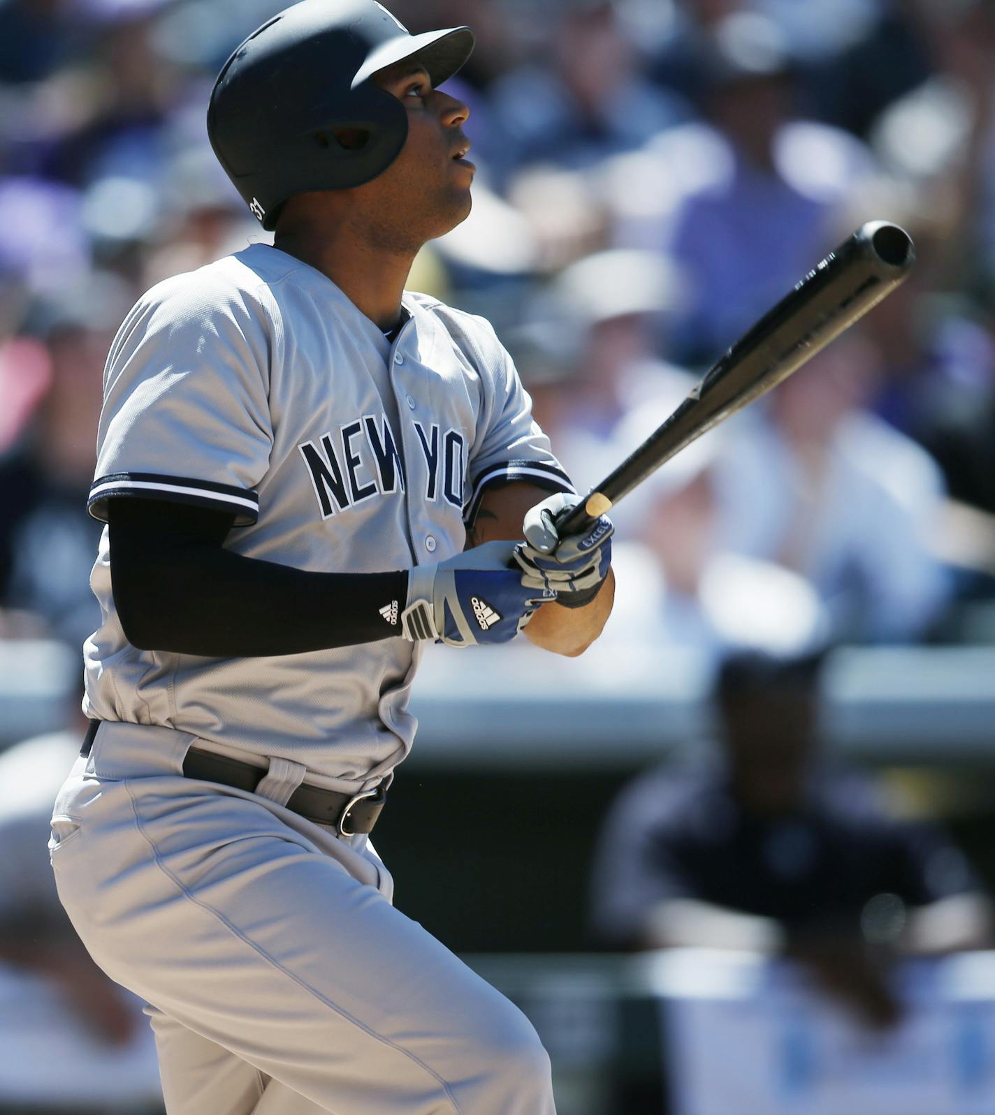 New York Yankees' Aaron Hicks follows the flight of his RBI-single off Colorado Rockies starting pitcher Chad Bettis in the sixth inning of a baseball game Wednesday, June 15, 2016, in Denver. Colorado won 6-3. (AP Photo/David Zalubowski)