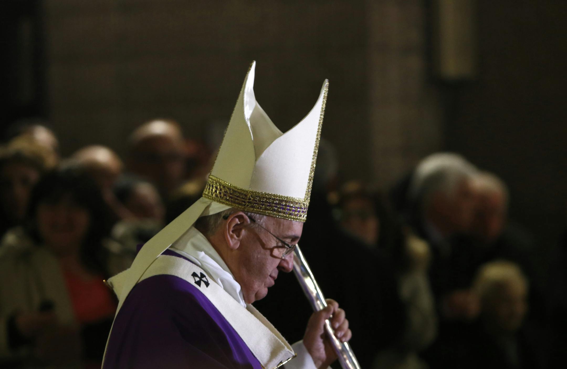 Pope Francis walks in procession after celebrating a mass on the occasion of a pastoral visit to the Santa Maria Madre del Redentore parish church on the outskirts of Rome, Sunday, March 8, 2015. (AP Photo/Riccardo De Luca)