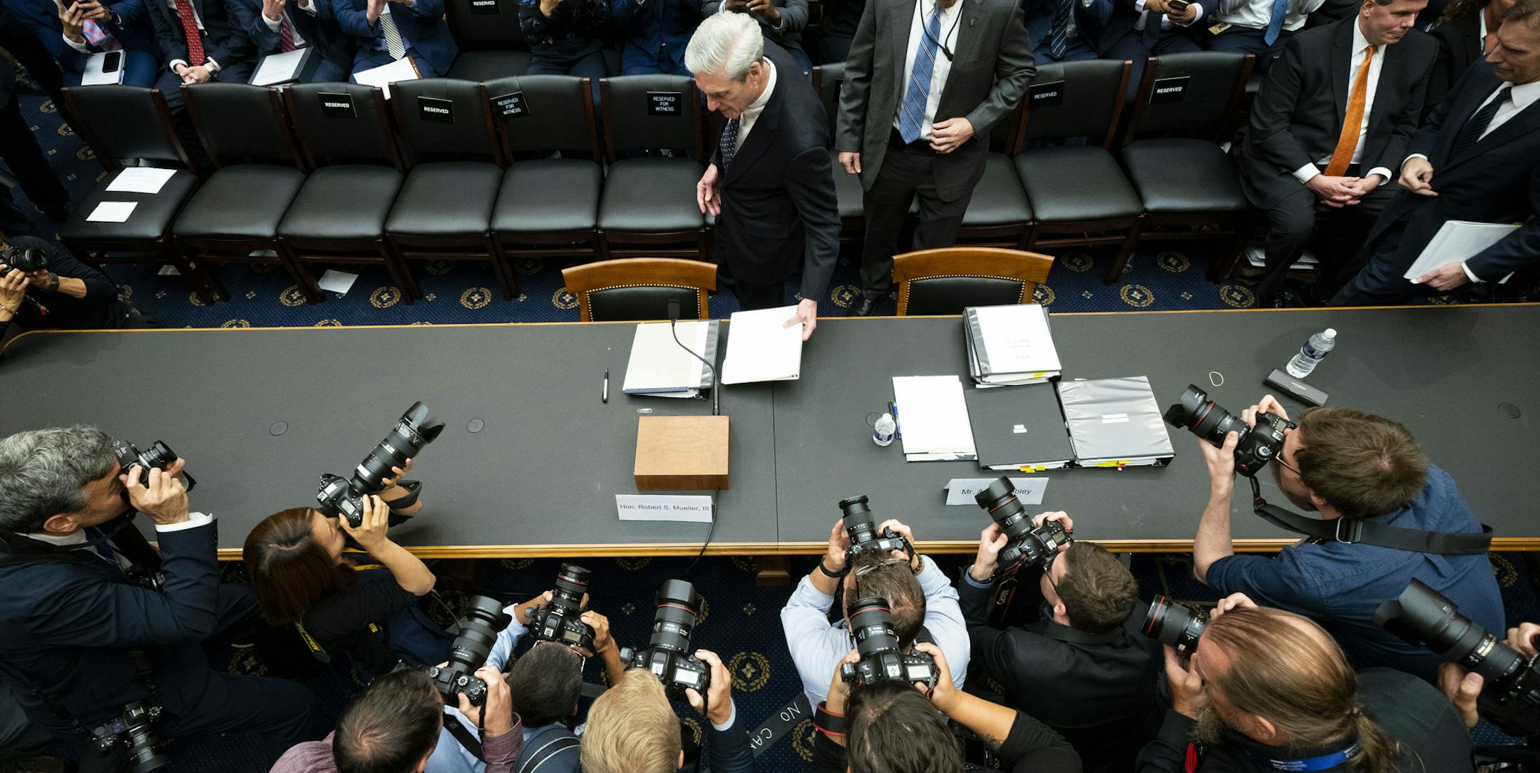 Former Special Counsel Robert Mueller are photographed before the start of a House Intelligence Committee hearing in Washington on Wednesday, July 24, 2019. (Doug Mills/The New York Times)