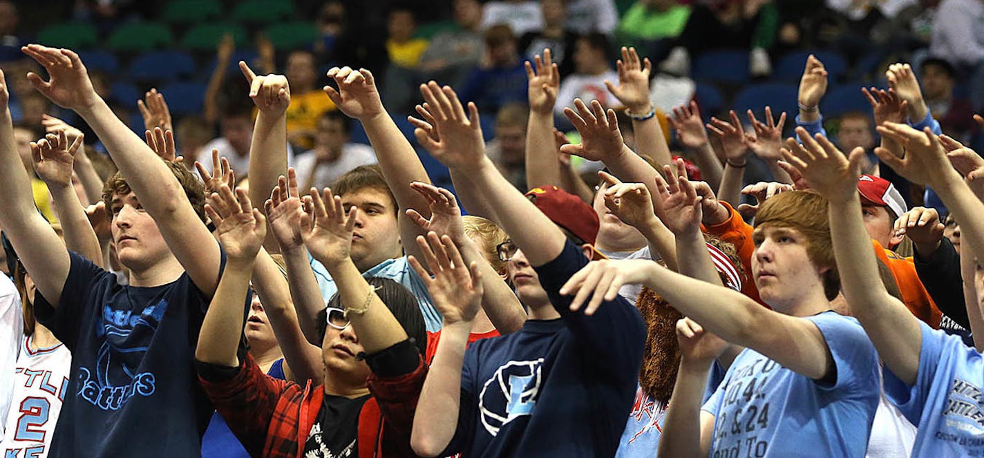 Fans at the Minnesota state boys' basketball team tried to distract an opponent during a free throw.