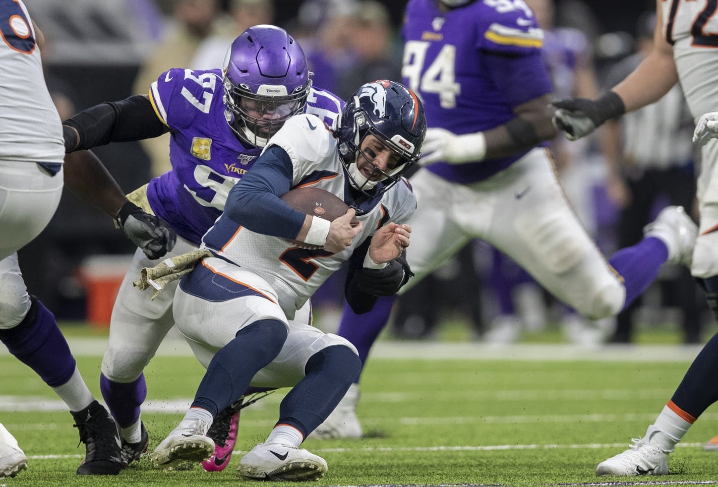 Minnesota Vikings defensive end Everson Griffen (97) sacked Denver Broncos quarterback Brandon Allen (2) in the third quarter at U.S. Bank Stadium.