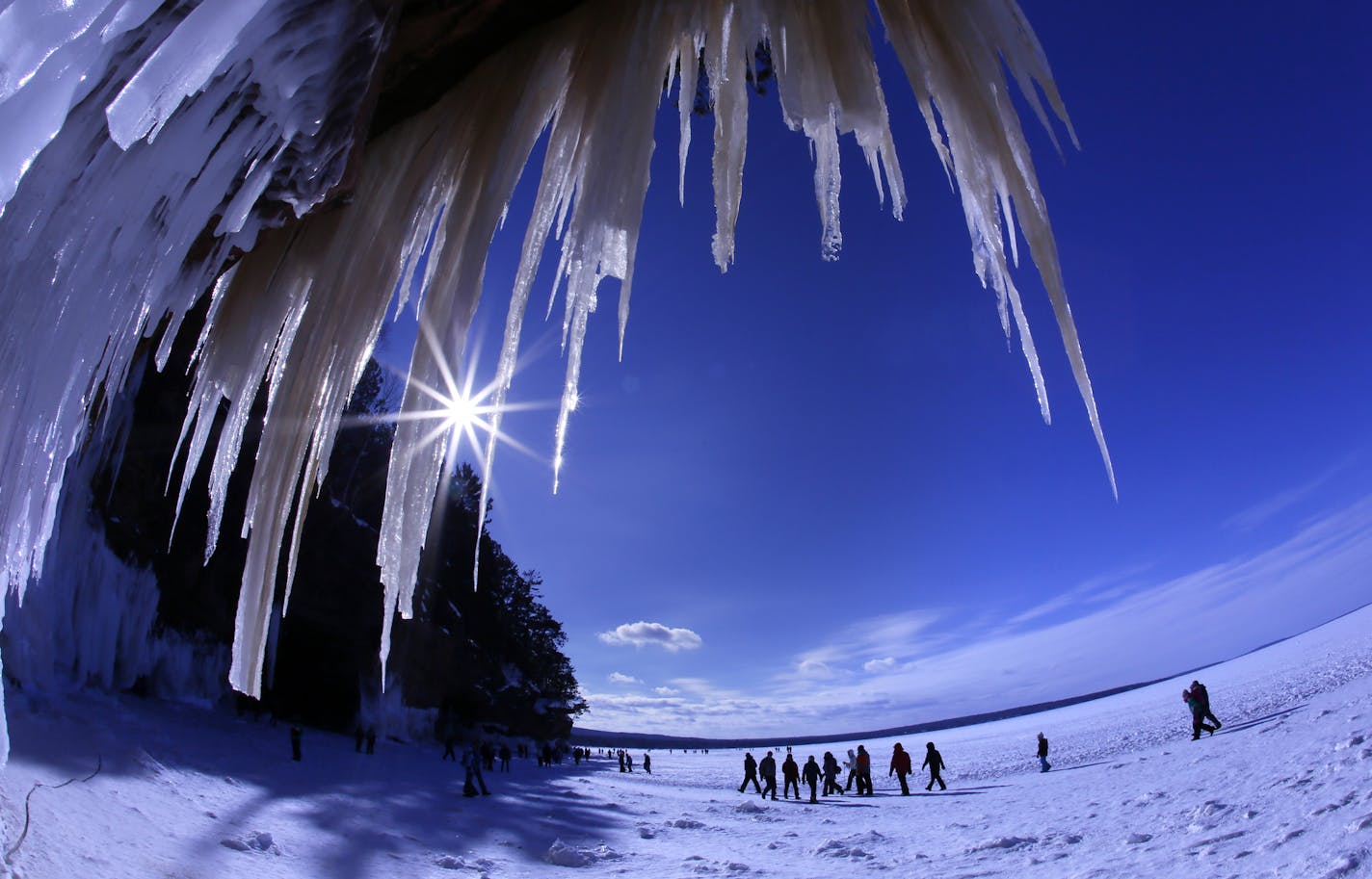 Thousands of people have been making the mile walk along the frozen shore to witness the crystal wonders of the caves at Apostle Islands National Lakeshore.