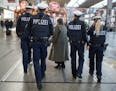 Police patrol at Munich main train station Wednesday Nov. 18, 2015. as government increased security measures following the Friday's attacks in Paris.
