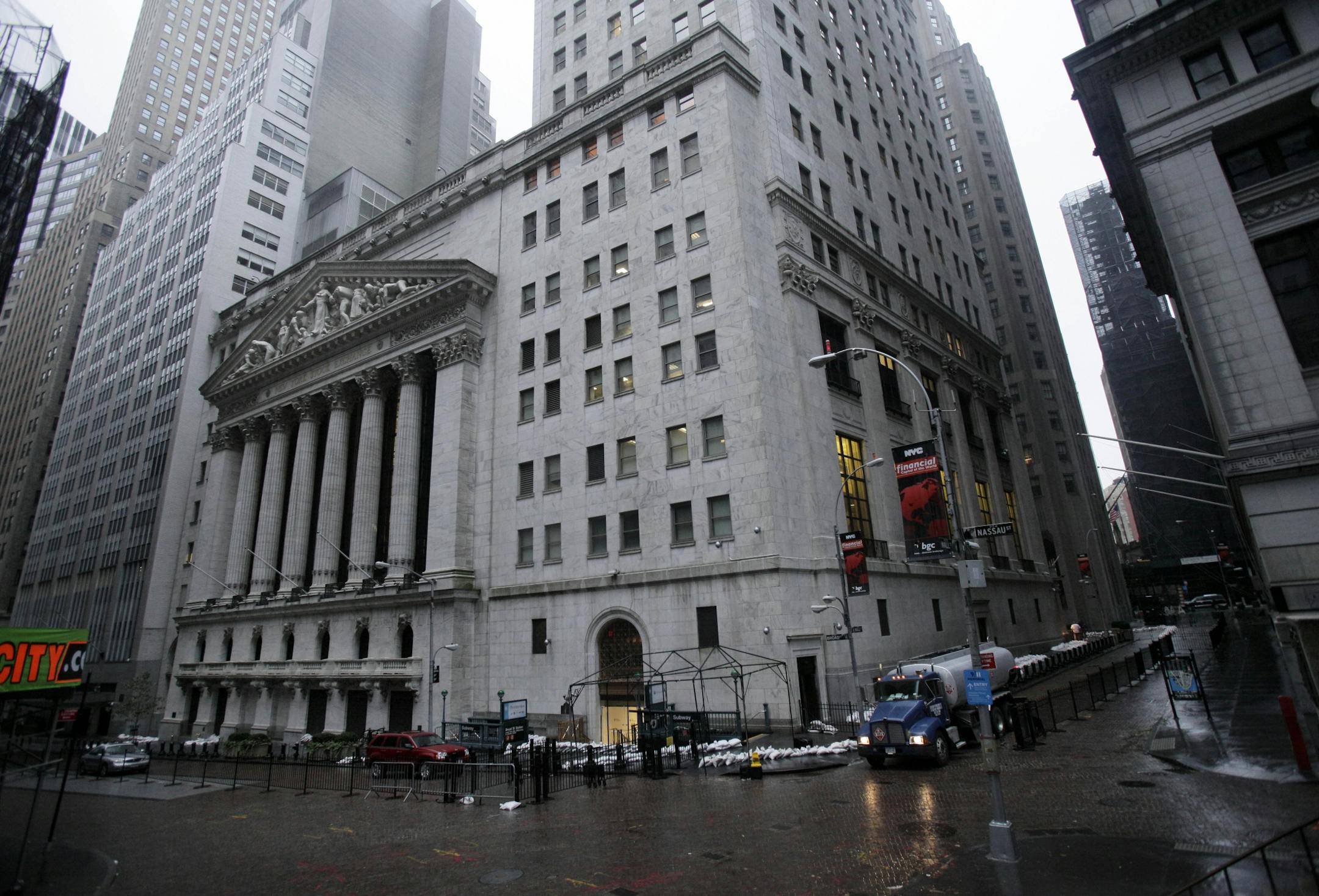 The streets surrounding the New York Stock Exchange are deserted as financial markets remain closed for the second day due to superstorm Sandy, Tuesday, Oct. 30, 2012. Sandy, the storm that made landfall Monday, caused multiple fatalities, halted mass transit and cut power to more than 6 million homes and businesses.