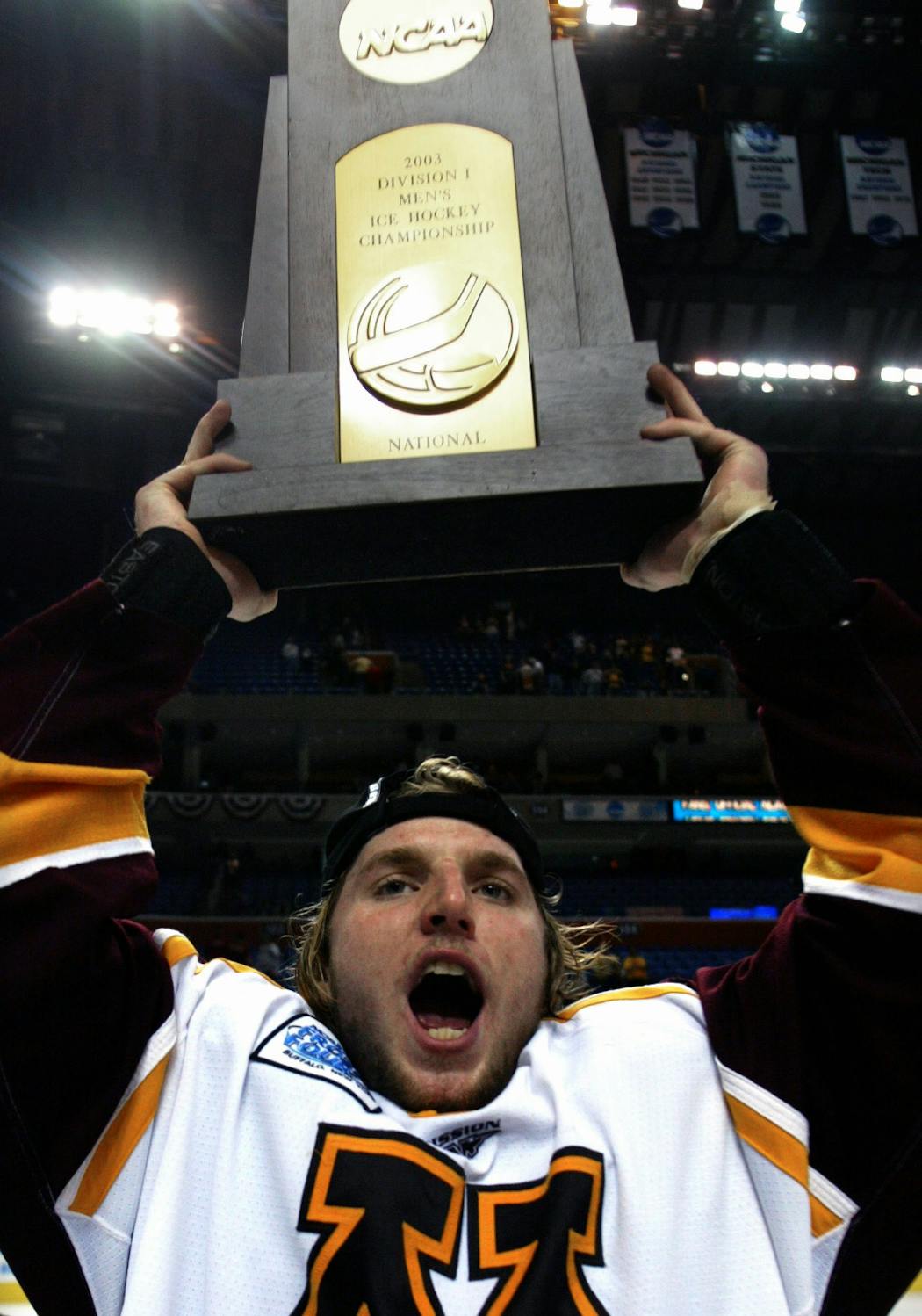 Then-freshman Thomas Vanek celebrated with the 2003 men's Frozen Four trophy after the Gophers defeated New Hampshire for the NCAA championship.  Vanek was named the player of the game.