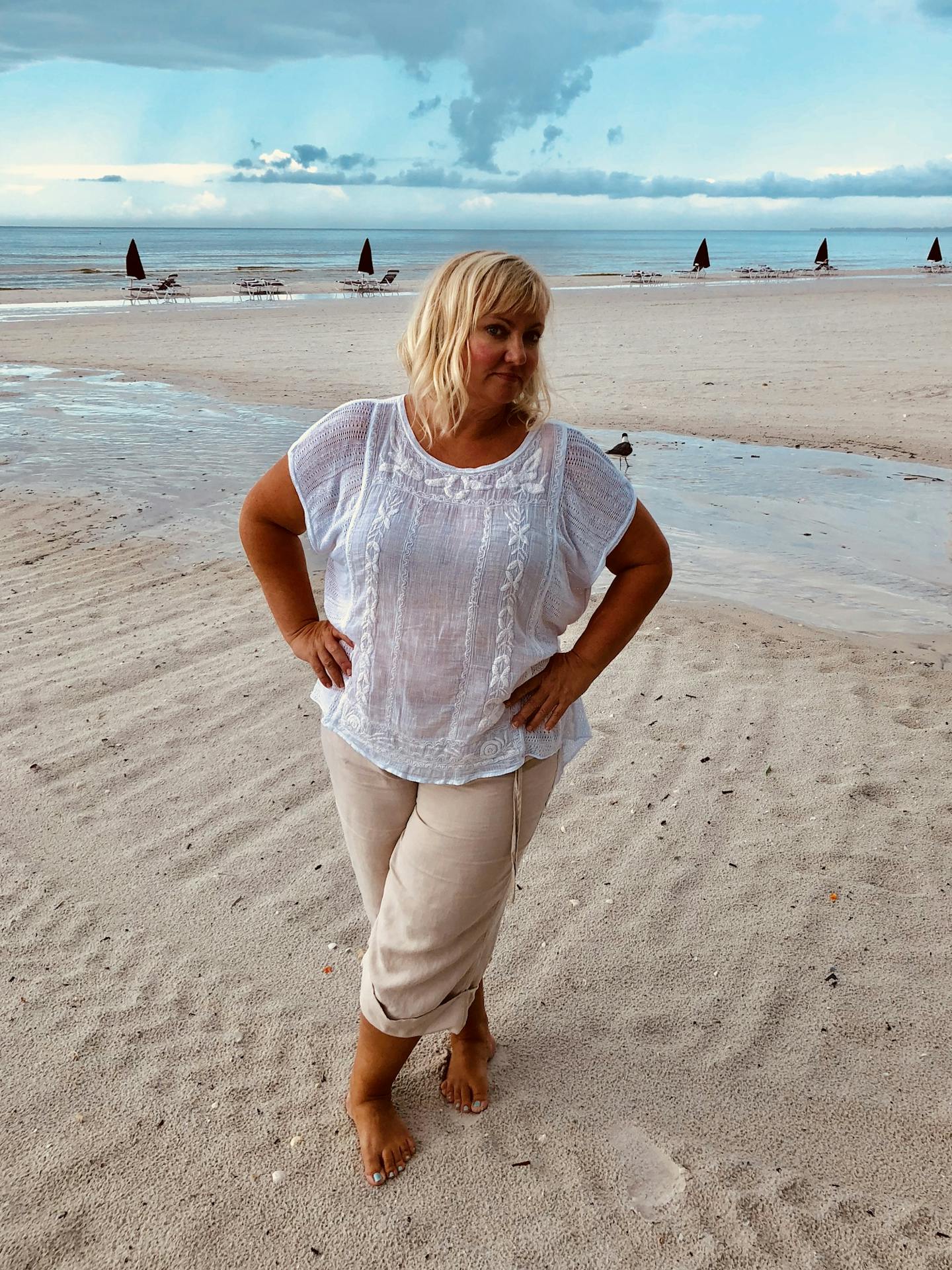 Heidi Thompson on the beach in Fort Myers, Fla., where a red tide prompted the governor to declare a state of emergency.