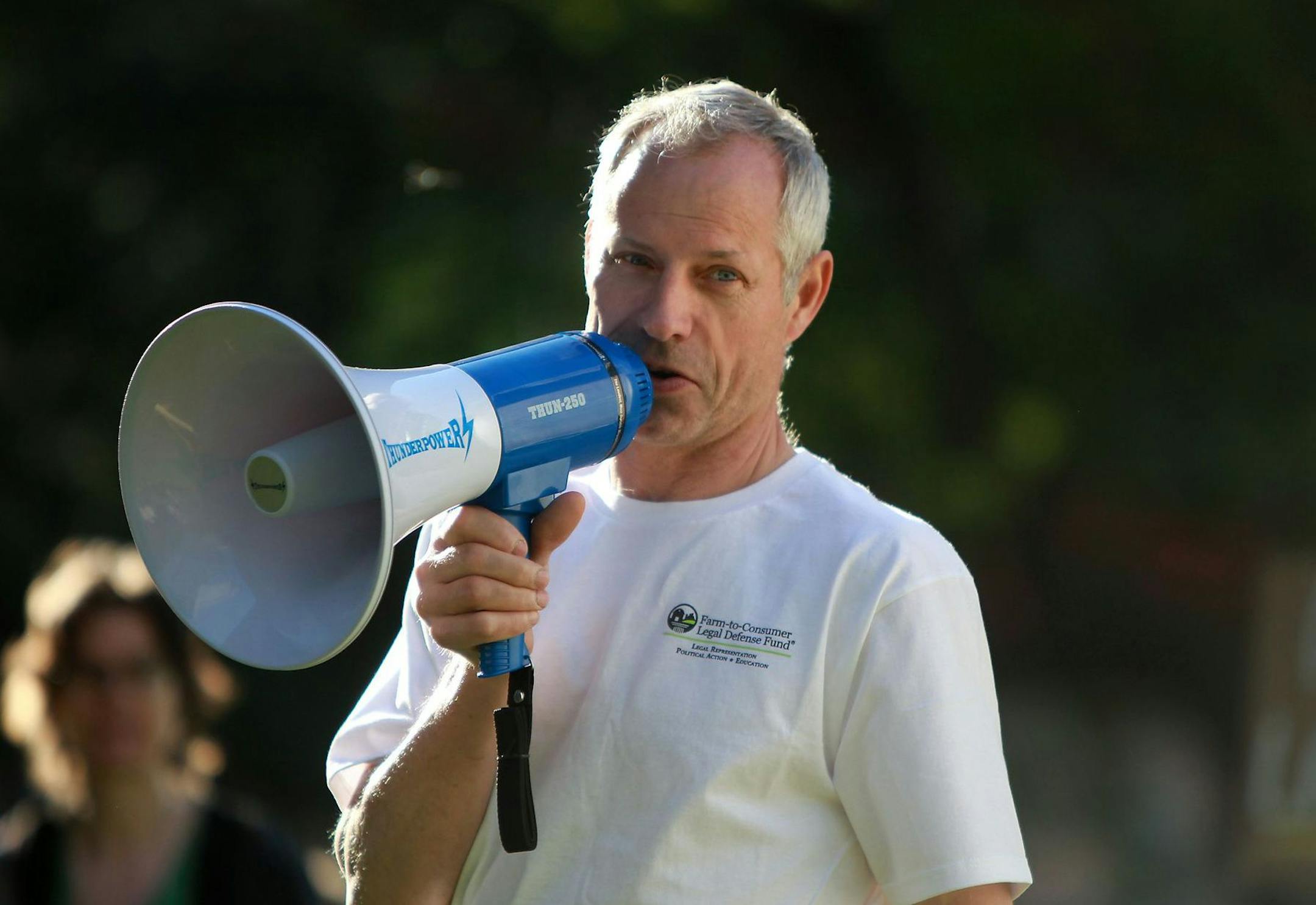 Alvin Schlangen addressed supporters during a rally by raw milk advocates outside the Hennepin County courthouse plaza, Monday, May 14, 2012. On Tuesday morning Alvin Schlangen is going on trial for breaking the state's raw milk laws. (Schlangen is an egg farmer, but also has distributed raw milk).(ELIZABETH FLORES/STAR TRIBUNE) ELIZABETH FLORES • eflores@startribune.com ORG XMIT: MIN2013040519240770