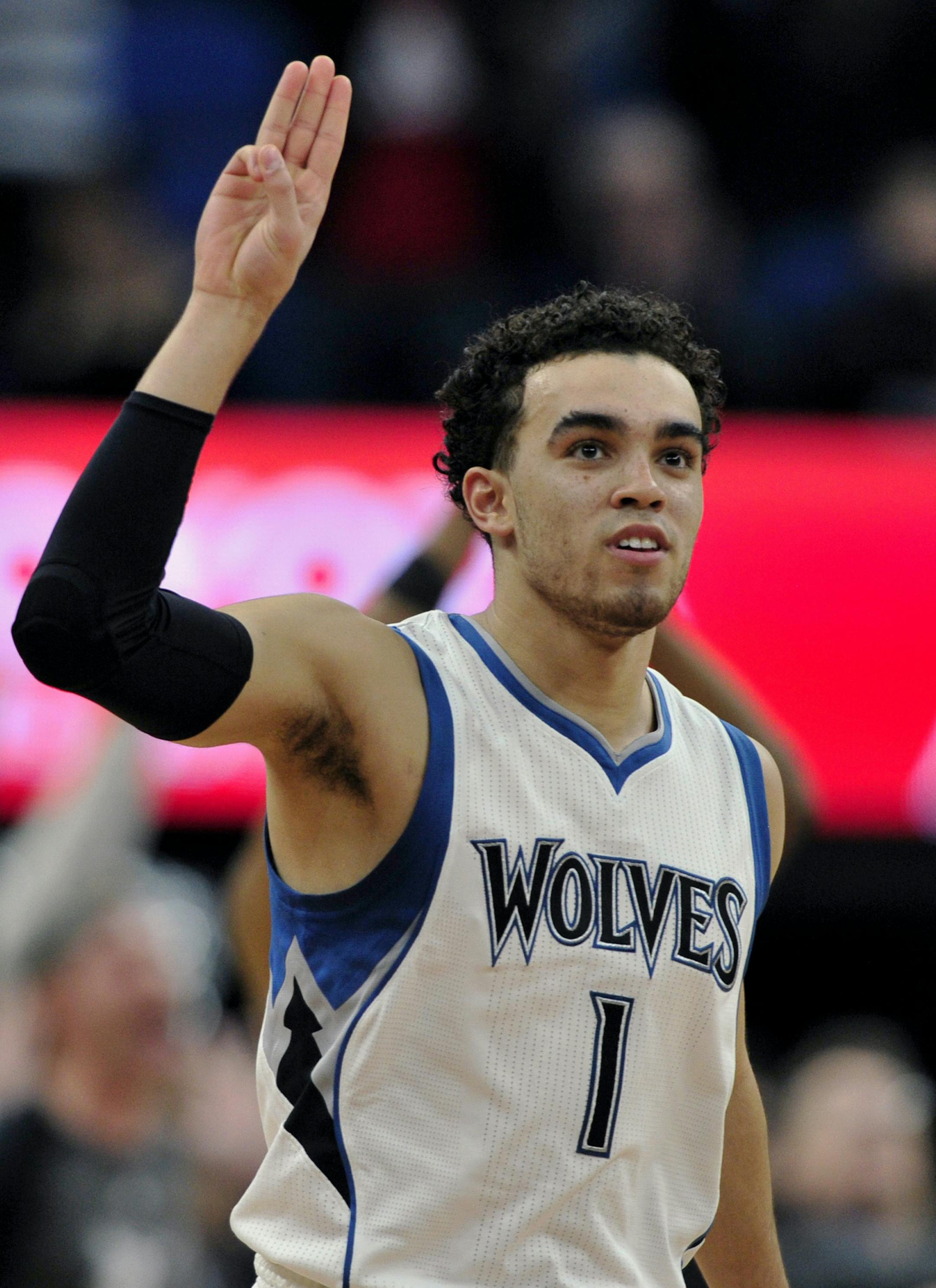 Minnesota Timberwolves guard Tyus Jones (1) celebrates a the go ahead three point shot against the Toronto Raptors during the fourth quarter of an NBA basketball game on Wednesday, Feb. 8, 2017, in Minneapolis. The Timberwolves won 112-109. (AP Photo/Hannah Foslien)