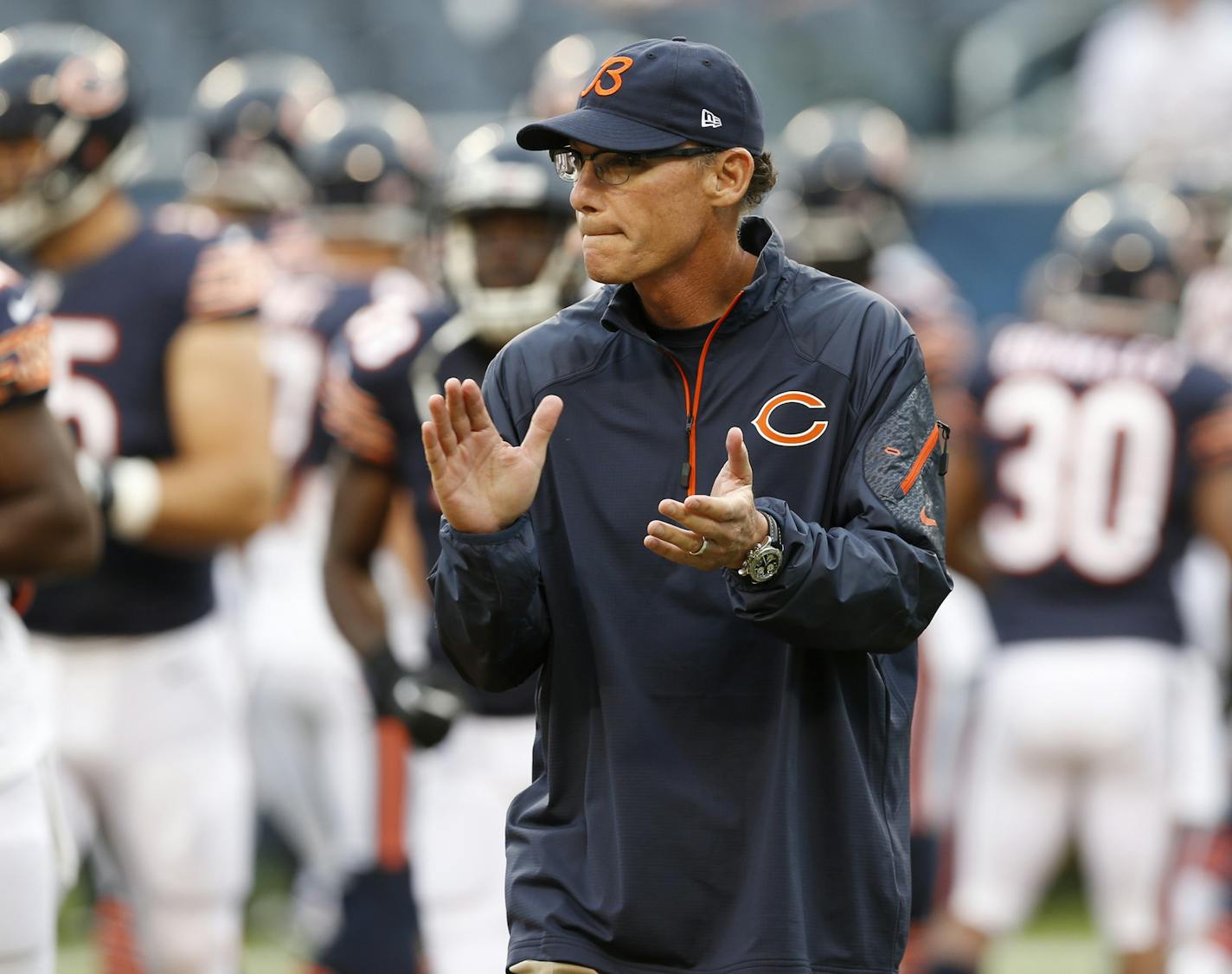 Chicago Bears head coach Marc Trestman walks around the field before a preseason NFL football game against the San Diego Chargers, Thursday, Aug. 15, 2013, in Chicago.