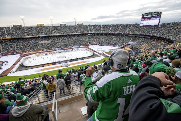 Dallas Stars fans watch play during the second period of the NHL Winter Classic hockey game between the Dallas Stars and the Nashville Predators at th