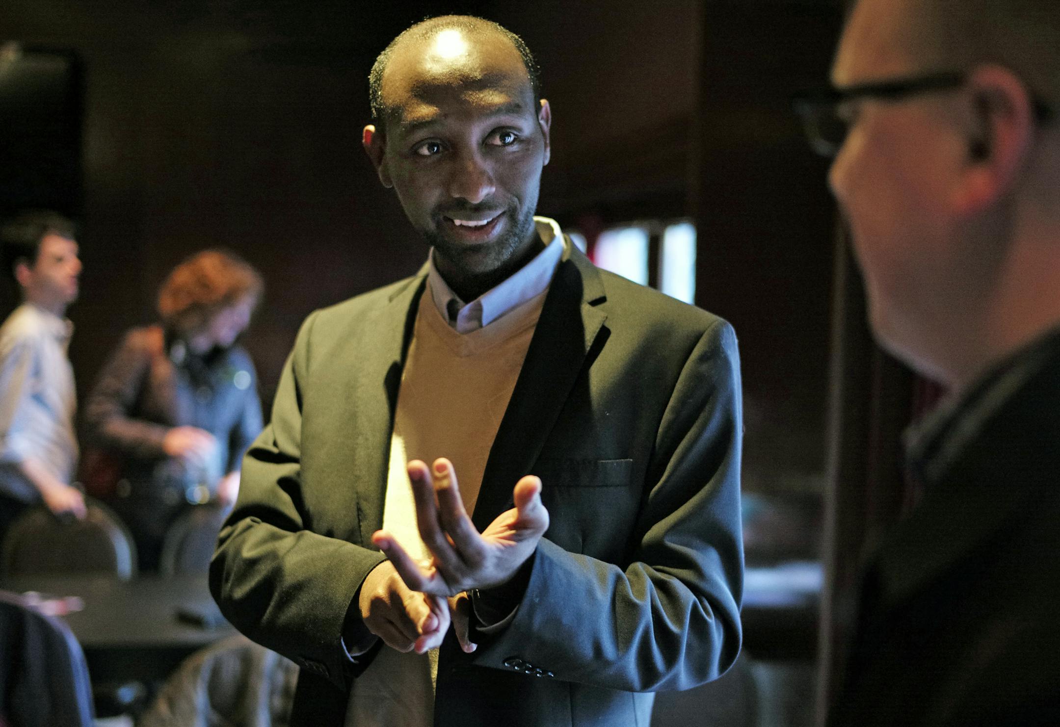 At a fundraiser held at Wilde Roast in Minneapolis, school board member Mohamud Noor, who is challenging State Rep. Phyllis Kahn, chatted with supporters. Noor, a computer scientist impressed Melissa Hysing and Mike Pfarr with knowledge of the issues plaguing MnSure.]richard.tsong-taatarii/rtsong-taatarii@startribune.com