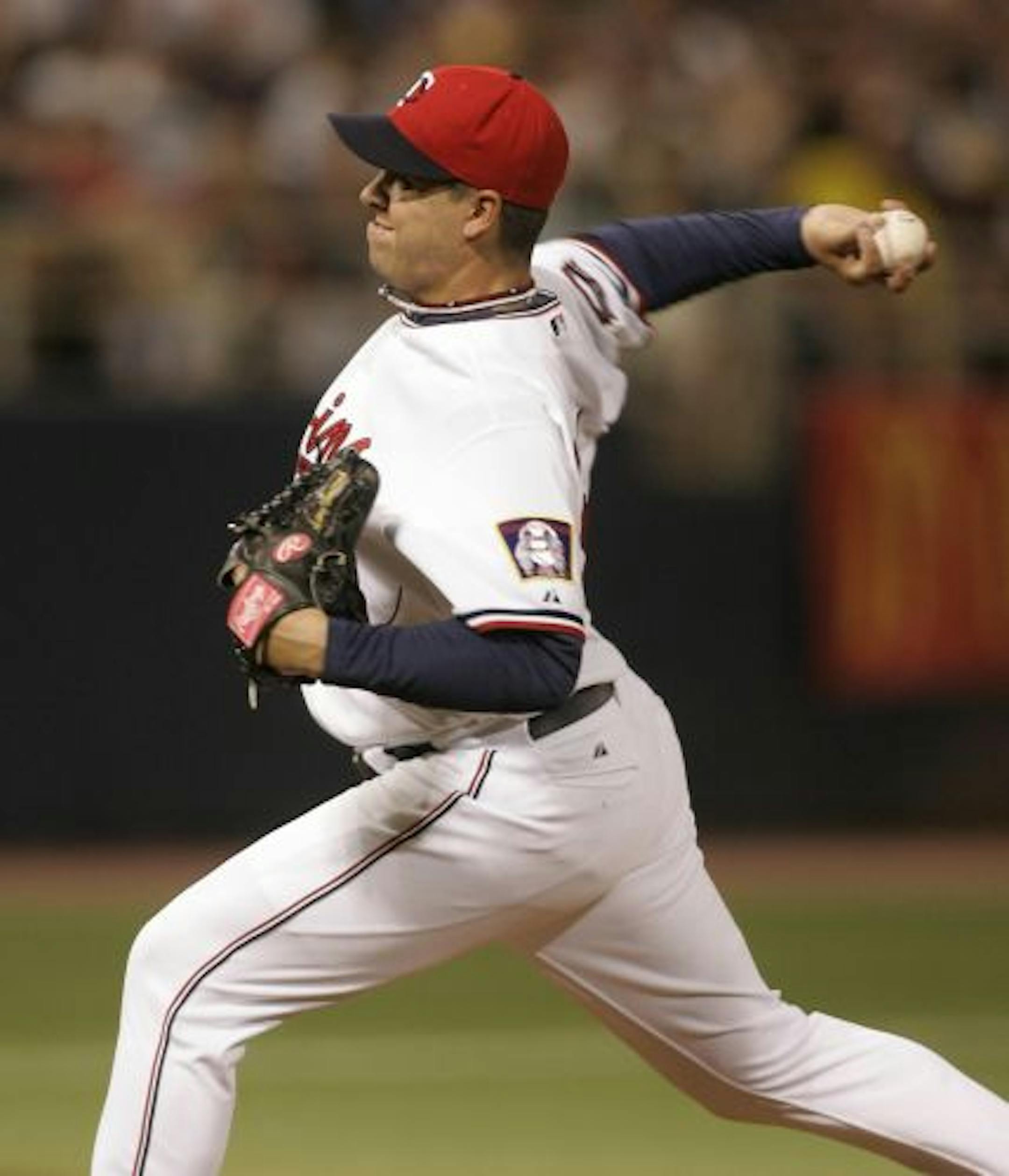 Minnesota Twins starter Anthony Swarzak fires a pitch during the 1st inning of the Twins game with the Milwaukee Brewers at the Metrodome.
