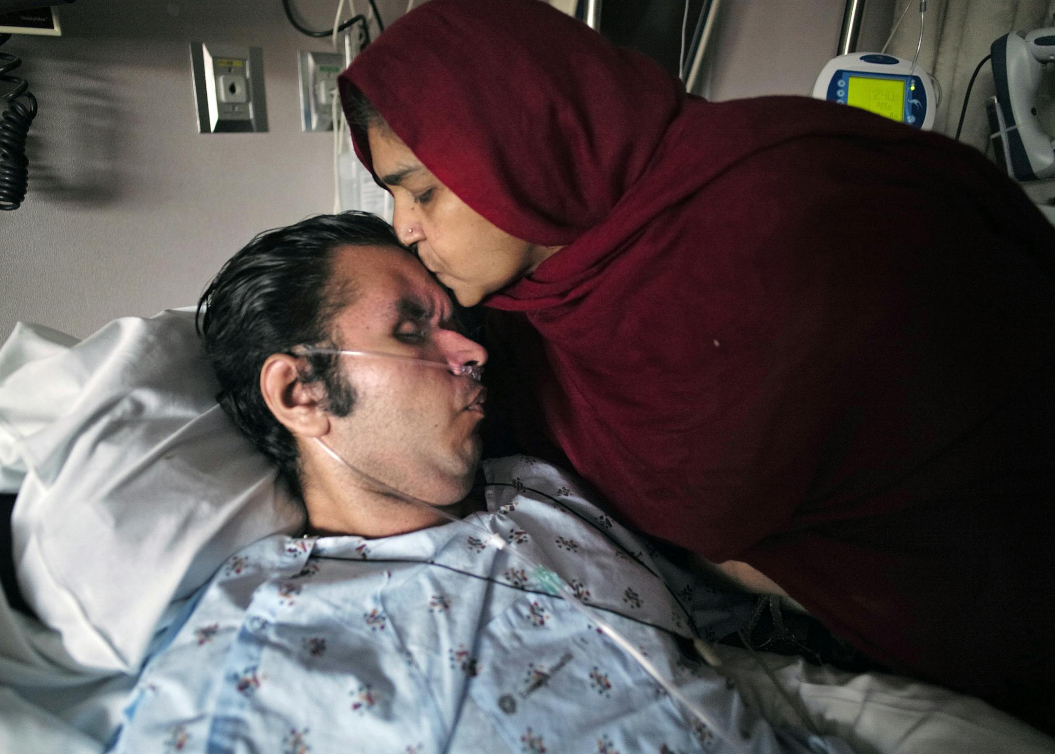 At St. Mary's Medical Center in Duluth, Tanzeela Bajwa prays constantly for her son, Muhammad, who lies comotose in a hospital bed.