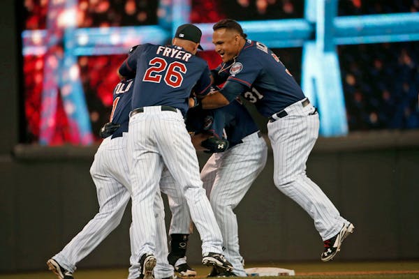 The Twins celebrate after their 5-4 win over the Chicago White Sox.