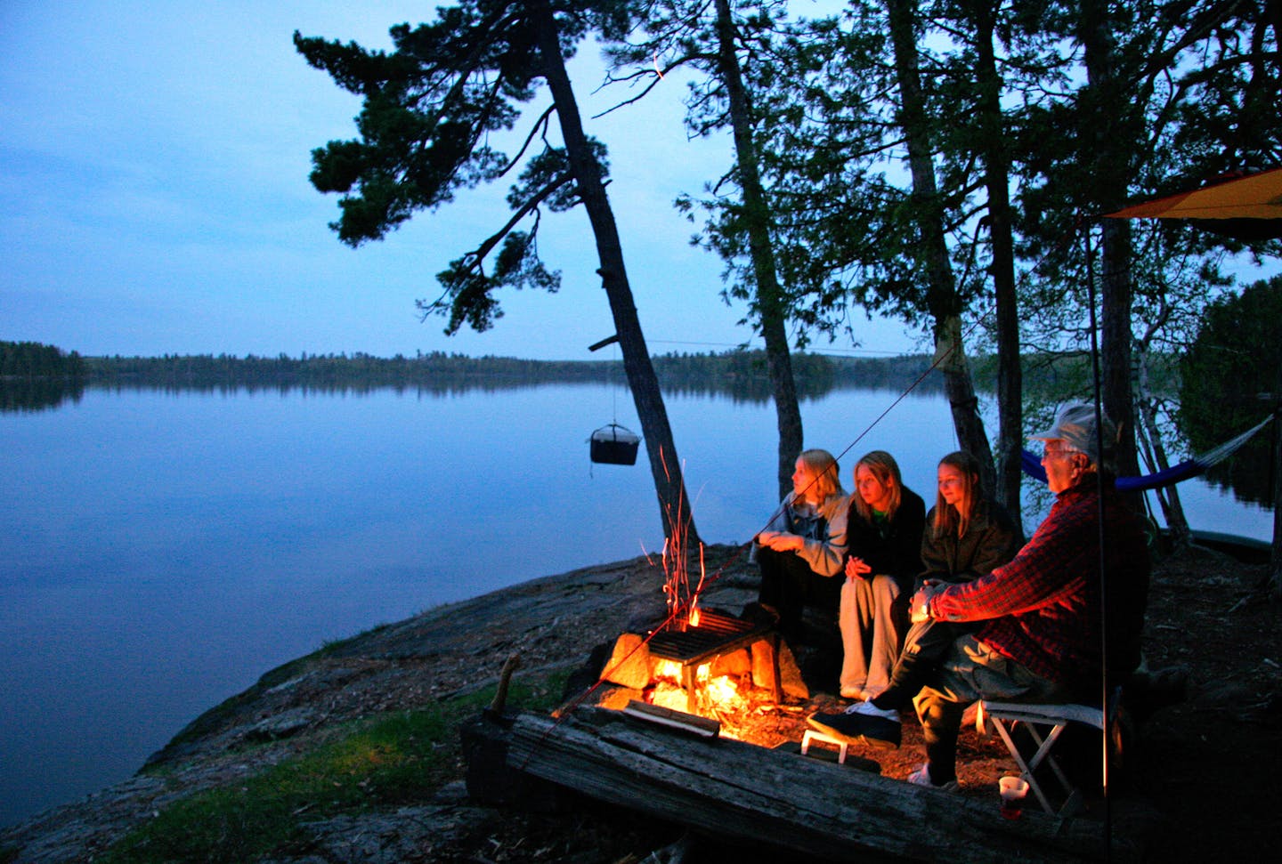 The Big List on camping, from how to pick a tent to homemade canoe packs to glamping and picking the best campsite. Here, Sarah Ozment, Alyssa Chandler, Natalie Peterson with around the Campfire at Lake Three in the BWCA with their grandfather Ken Johnson. ] BRIAN PETERSON &#xef; brian.peterson@startribune.com
BWCA, MN 03/24/17 ORG XMIT: MIN1703241300568886