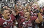 Montana's Chris Parker (4) and Kendrick Van Ackeren (35) celebrate with teammates after their NCAA college football game against North Dakota State Sa