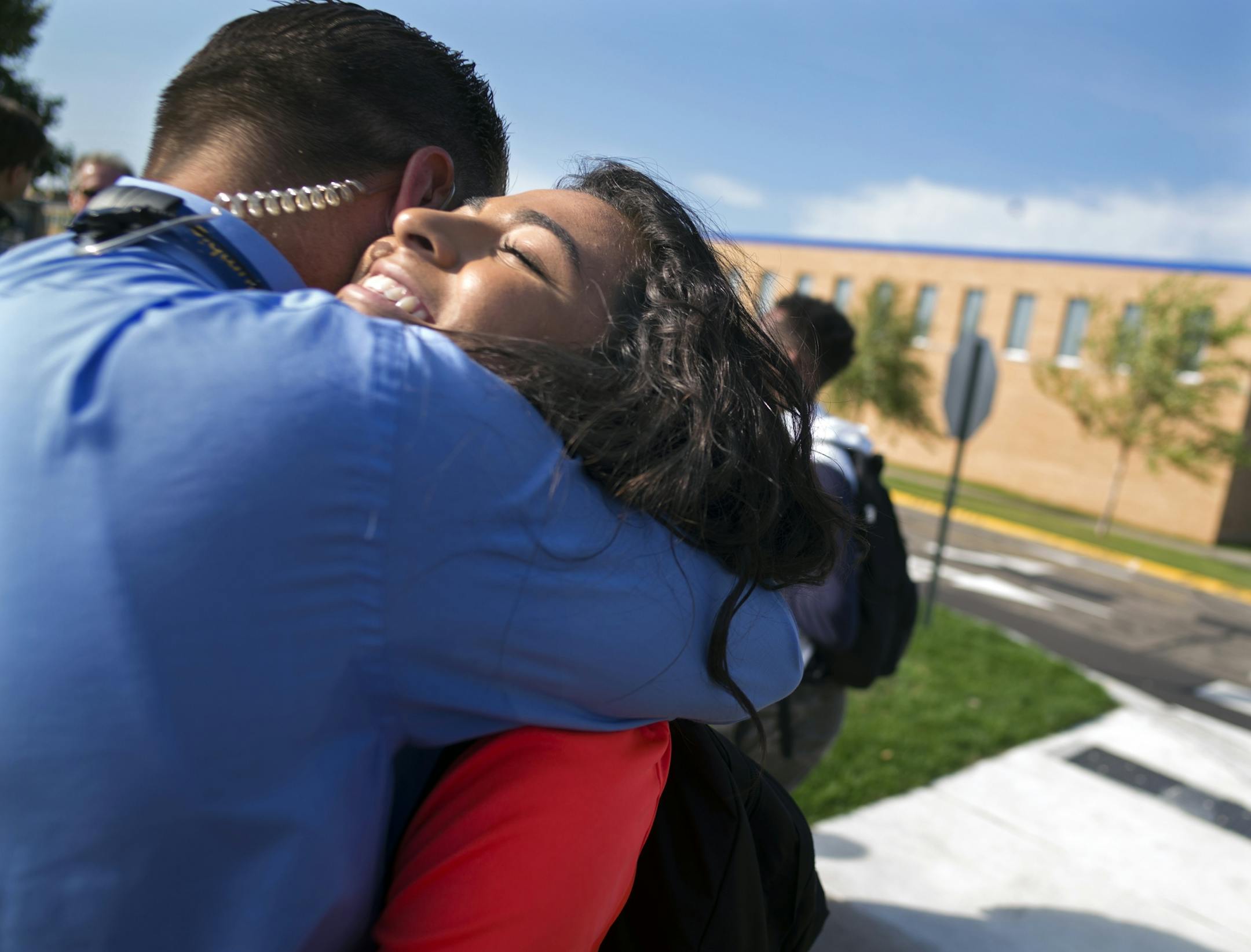At Columbia Heights H.S., students Sherouk Mohamed,17,(orange), walked out in solidarity against a school board member's anti-muslim comments. Principal Dan Wroblewski gave her a hug and came out to lead the students back to class. He also led the walkout in solidarity with the students.