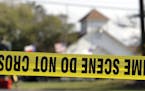 Law enforcement officials continue to investigate the scene of a shooting at the First Baptist Church of Sutherland Springs, Tuesday, Nov. 7, 2017, in