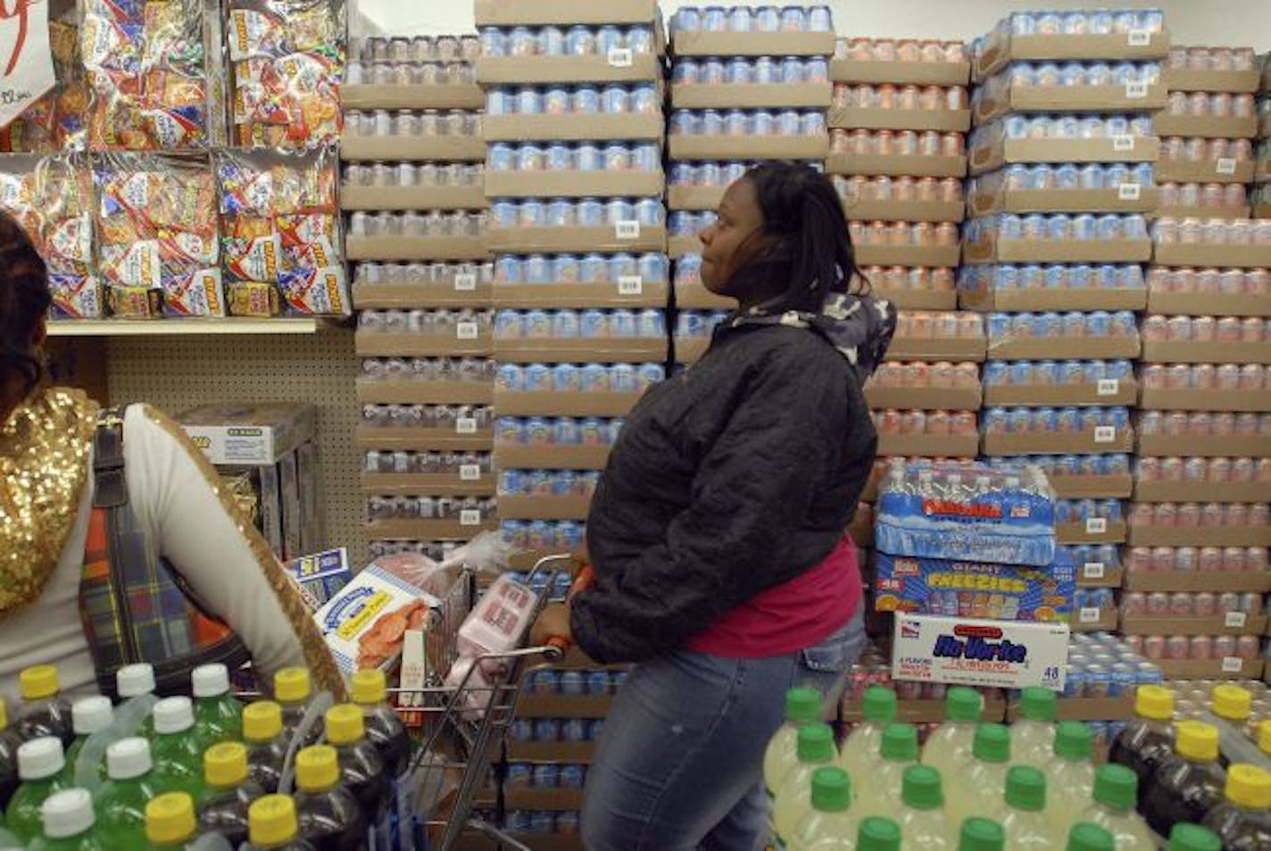 File photo: A shopper at the One Stop Food store on the south side of Chicago, which opens it doors at midnight on the first of each month for the express purpose of letting her and a dozen or so others to start shopping the instant they have access to the new month's allotment of food stamps.