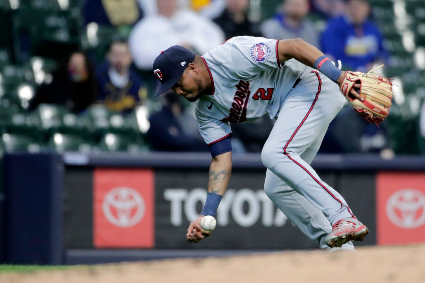 Luis Arraez was unable to field a ground ball during the third inning Thursday. Later defensive lapses cost the Twins on Opening Day.