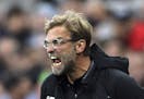Liverpool manager Jurgen Klopp reacts on the sidelines during the Premier League soccer match at against Newcastle at St James' Park, Newcastle, Engla
