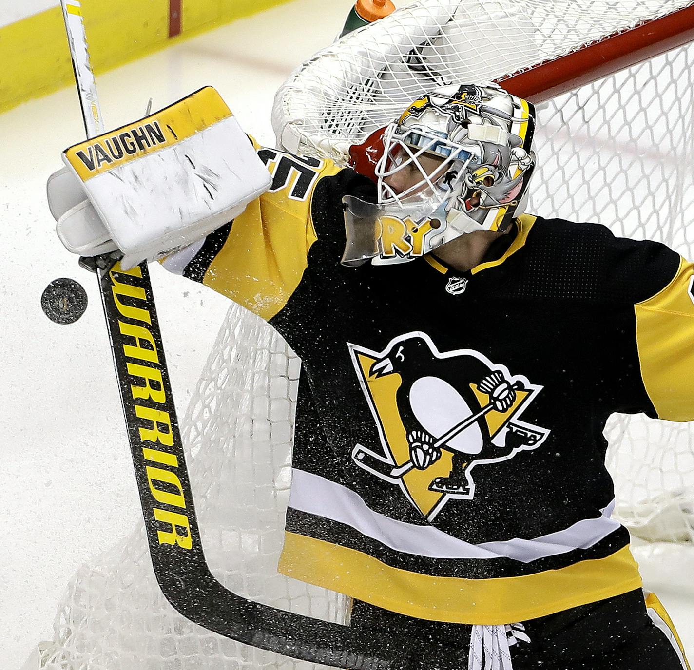 Pittsburgh Penguins goaltender Tristan Jarry stops a shot during the first period of an NHL hockey game against the Montreal Canadiens in Pittsburgh, Tuesday, Dec. 10, 2019. (AP Photo/Gene J. Puskar)