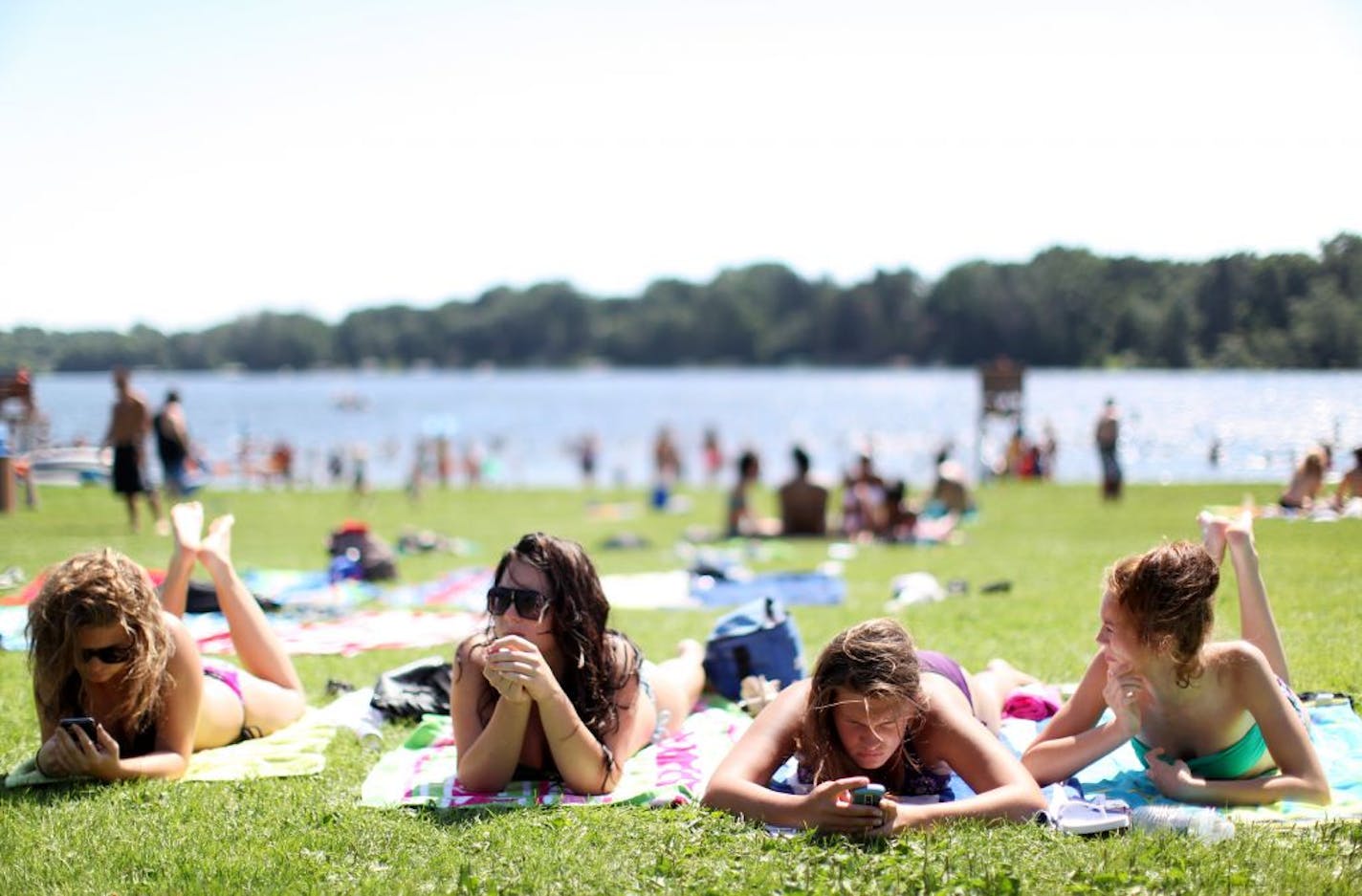 From left, Emily Dearing, Faye Bozyk, Jacquelyn Huseby and Sadie Bozyk, all of Champlin, enjoyed a day in the sun recently at Long Lake Beach, a popular hangout for teens.