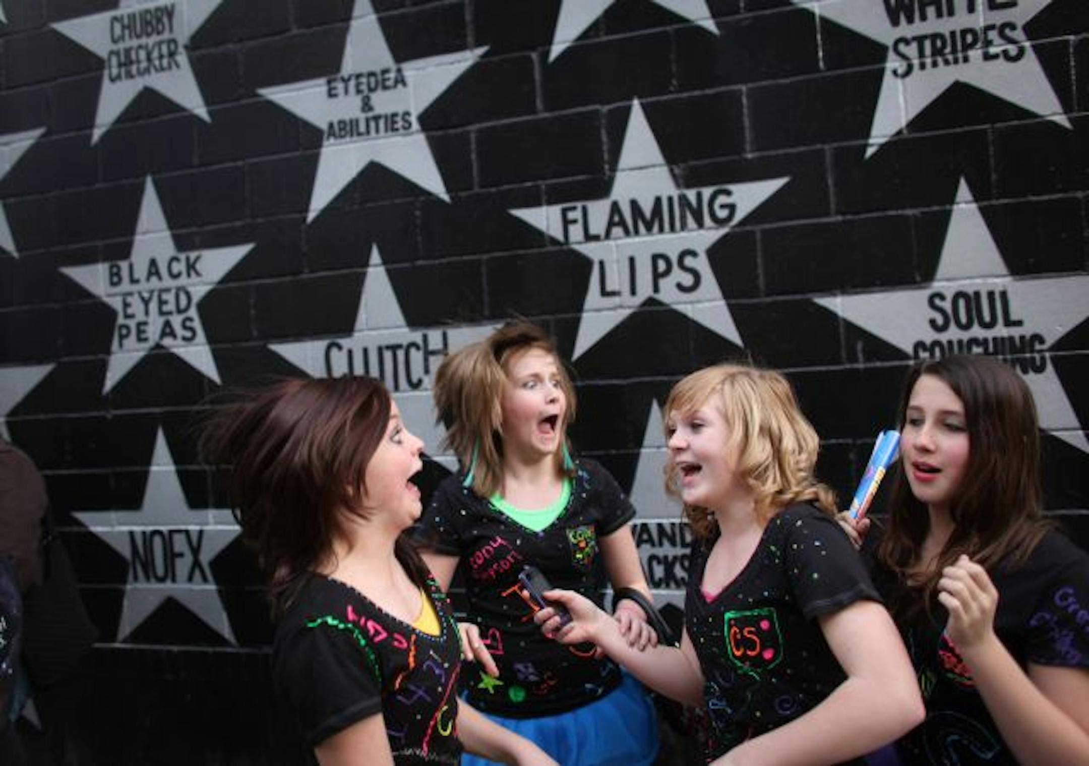 Best friends Allison Lovejoy, 12, Kenzie Bergland, 11, Tatum Pass, 12 and Jada Teta, 11, screamed with joy as they line for the Greyson Chance and Cody Simpson concert moved forward Wednesday night at First Avenue. Cody Simpson, 14, the Justin Bieber of Australia; Greyson Chance, 13, an Ellen DeGeneres prot�g� discovered on YouTube, are the youngest musicians to ever play at First Avenue, resulting in hundreds of tween girls lining up before the doors opened.