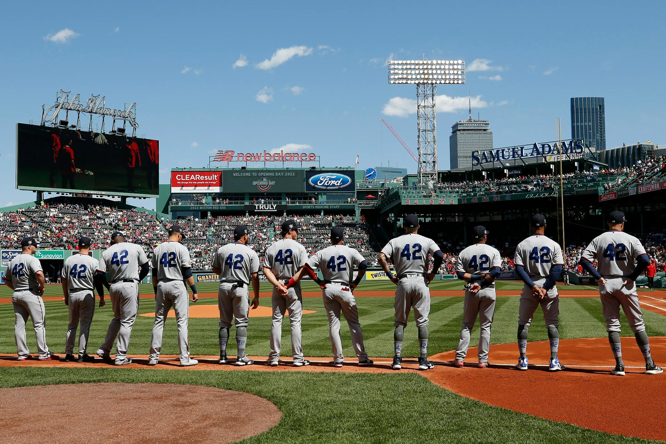 The Minnesota Twins line up on the base line before a baseball game against the Boston Red Sox, Friday, April 15, 2022, in Boston. (AP Photo/Michael Dwyer)