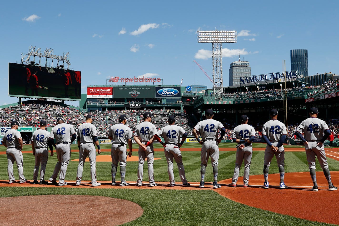 The Minnesota Twins line up on the base line before a baseball game against the Boston Red Sox, Friday, April 15, 2022, in Boston. (AP Photo/Michael Dwyer)