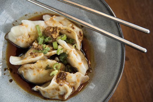Sichuan dumplings with chili sauce.