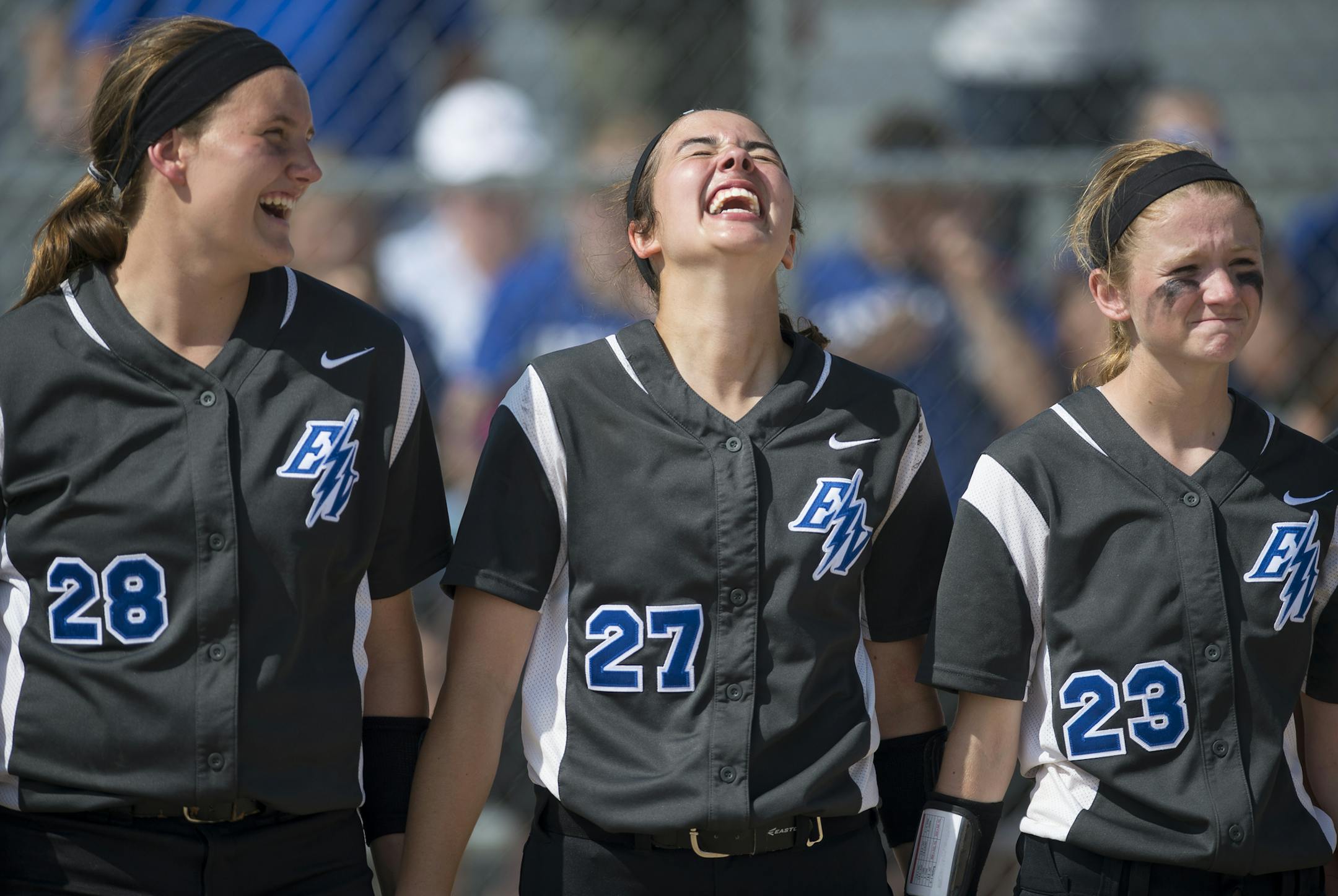 From left, Eastview pitcher Jessi Decovich (28), shortstop Melissa Barry (27) and outfielder Hailey Monroe (23) held hands during the trophy ceremony Friday. ] Aaron Lavinsky • aaron.lavinsky@startribune.com The softball state tournament finals were held Friday, June 5, 2015 at Caswell Park in Mankato.