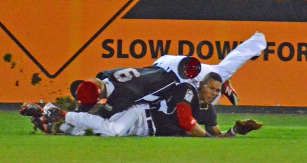 Top Twins prospect Byron Buxton, bottom, collided with fellow outfielder Mike Kvasnicka (No. 9) on Wednesday during a New Britain Rock Cats game. New 