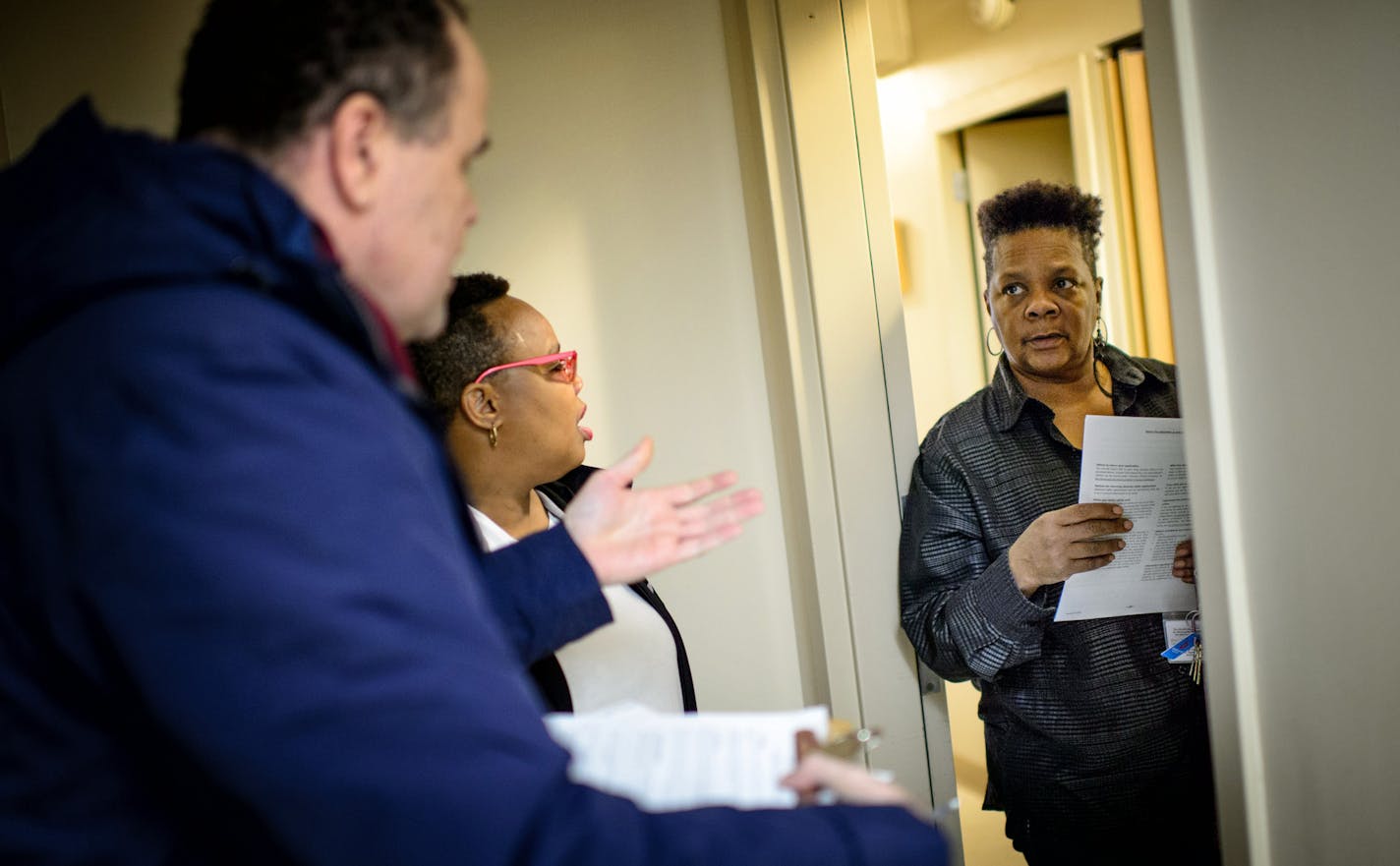 Andrew Vieden and Artiste Mayfield talked with resident Purple Rain Wright as they knocked on doors in a North Minneapolis apartment building asking if residents had any concerns or issues that they could pass along to U.S. Rep. Keith Ellison. They heard about his stand on the 4th district protests, nonprofit agencies that don't deliver on their promises and traffic problems. ] GLEN STUBBE * gstubbe@startribune.com Friday, December 11, 2015 Keith Ellison says he can change the way American polit