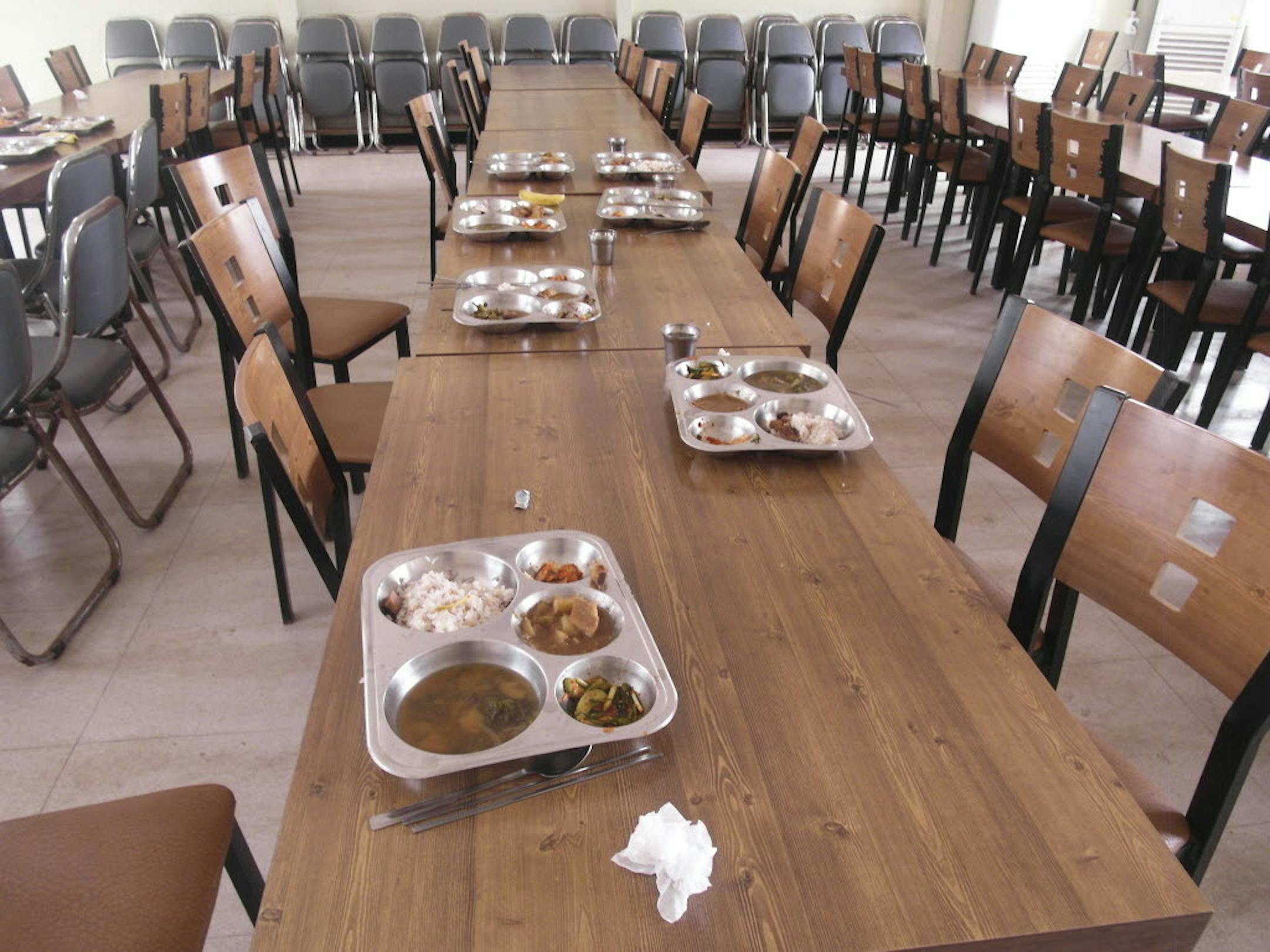 March 31, 2014: Lunch trays for students are left on tables of a cafeteria after students were evacuated to a shelter at a school on Yeonpyeong Island, South Korea.