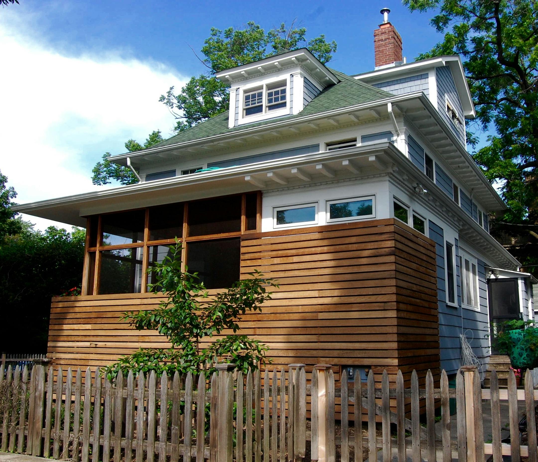 The homeowners built an urban oasis on the side of their foursquare.