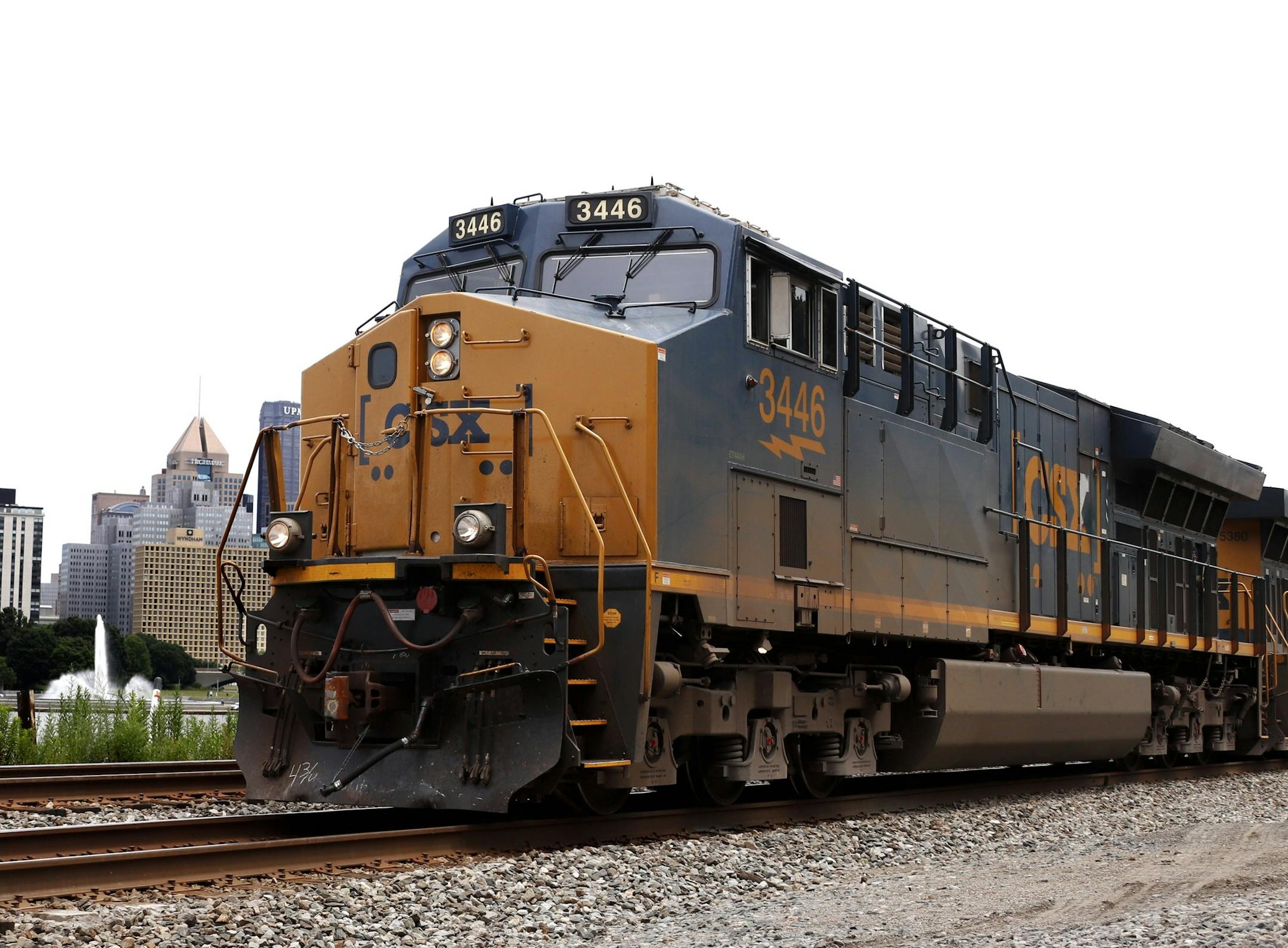 In this June 24, 2019, photo a CSX freight train rolls past downtown Pittsburgh. CSX Corp. reports financial results on Tuesday, July 16. (AP Photo/Gene J. Puskar) ORG XMIT: MERf961fda4b47559b1657444e6609fd
